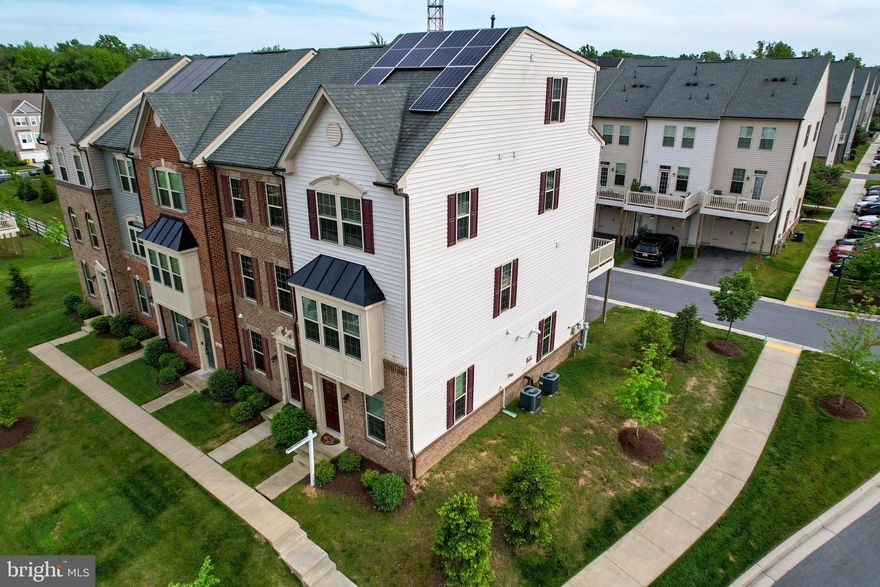 This beautiful, end-unit garage townhome is minutes from Ft. Meade and is in the highly regarded Parkside community.  Enter this 4-level townhome through the front door or the attached, oversized garage. The entry level features a recreation room/office and a half bath. The main level boasts an open floor plan with gourmet kitchen, breakfast bar, dining area, family room and large low maintenance composite deck off of the kitchen.  The kitchen stuns with its granite countertops, stainless steel appliances, center island and extended cabinets. On the third floor you will find the laundry closet, primary bedroom with dual closets and en-suite bathroom featuring dual showerheads, a hallway full bathroom and flex space which leads upstairs to the 4th floor with a second primary bedroom with en-suite bathroom.  The fourth floor is a coveted limited edition. 

The solar panels are owned and allow for a minimal monthly electric bill or depending on your energy use could even provide a credit.  Recessed lighting and smart home capabilities are found throughout the home too.  

2.75% VA Assumable loan may be available to another service member who qualifies and can substitute their entitlement.

The Parkside community offers a community pool, tot lots, fitness center, club house, walking trails and so much more.  This home is just minutes from Fort Meade as well as an abundance of local shopping and dining. Location allows easy access to major commuter routes including 100, 32, 95 and is convenient to BWI, Baltimore/Annapolis/DC and the MARC train station.