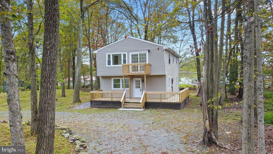 Fully renovated 4-Bedroom 3 FULL Bath Home with Exceptional Upgrades! Step onto your brand-NEW deck and into a home that was thoughtfully designed with high end finishes throughout.  Not your average updates - with a NEW roof, NEW modern kitchen and baths, NEW vinyl wood flooring throughout, NEW hot water heater, Recessed lighting, ceiling fans and efficient DUCTLESS heating/cooling units in each floor and in each bedroom ensuring personalized comfort and lower energy bills year-round. The open-concept kitchen and layout is great for both entertaining and flexibility whether you're looking for a second living area or spacious dining room with plenty of storage, sleek new stainless steel appliances quartz counters, tile backsplash, pantry closet and room to gather. First floor flexibility with a BONUS room/office and main floor full bathroom, and convenient laundry room. The 2nd floor Primary SUITE is impressive with cathedral ceilings, dual closets, your own BALCONY, and modern en-suite bathroom.  The circular driveway offers plenty of parking and a spacious yard to enjoy the outdoors.  Ask how to receive a $1,000 lender credit towards closing costs or lowering your interest rate!