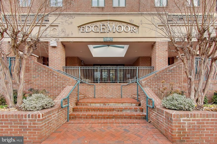 Welcome to an exceptional opportunity to own a stunning residence in one of downtown Bethesda’s most exclusive boutique buildings.  The Edgemoor at Arlington is a private community of just 11 residences, celebrated for its premier location, solid construction, exceptional management, and expansive outdoor balconies. Experience upscale urban living in this stunning 2-bedroom, 2-full-bath PLUS den in a corner unit  located in the heart of downtown Bethesda. 

Step into this home through a gracious vestibule entry, creating a refined sense of arrival before opening into a beautifully designed living space.  The open-concept living and dining areas are flooded with light from windows that frame stunning sunset views. This home features a generously sized dining area offering ample space for hosting dinner parties, holiday gatherings, and special occasions. The living room is accented by a beautiful tray ceiling with integrated lighting.  A spacious den, just off the living room, provides flexible living options, perfect for a home office, media room, or guest space.  Finishing off this living area is one of two balconies, a lovely sunlit space for potted plants and fresh air.

The chef’s kitchen is outfitted with top-of-the-line appliances, sleek finishes, and thoughtful design. At the center is a stylish island that creates the perfect spot for casual meals or morning coffee. Anchoring the space is an impressive oversized farmhouse sink with dual faucets. Here you will find the second balcony, a true extension of the living space, offering an inviting outdoor setting ideal for relaxing, dining, and entertaining. With ample room for comfortable seating, the balcony is the perfect place to host friends, enjoy al fresco meals, or unwind with a book while taking in the surrounding downtown views.

The primary bedroom is a luxurious private retreat, generously sized to accommodate a comfortable seating area. Another elegant tray ceiling creates a warm, refined ambiance. The suite is completed by a very large walk-in closet with abundant storage and a spa-inspired primary bathroom. The large secondary bedroom is thoughtfully designed to be both comfortable and highly functional, offering ample space for a dedicated work area. Just outside the bedroom, the hall stone-clad bathroom is beautifully appointed and includes universal design features, providing enhanced accessibility and ease of use.  A generously sized garage parking space and private storage unit are included, offering rare convenience and added value in downtown Bethesda.

The location is truly unparalleled—placing you at the very center of everything downtown Bethesda has to offer: award-winning restaurants, stylish boutiques, and everyday conveniences, including grocery stores, fitness studios, a public library, a short walk to the Bethesda Metro, and weekend farmer's market This is urban living at its finest—where walkability, convenience, and vibrant city energy come together in one extraordinary address.

Total estimated square footage is 2020 with an additional 201 square footage in balconies.