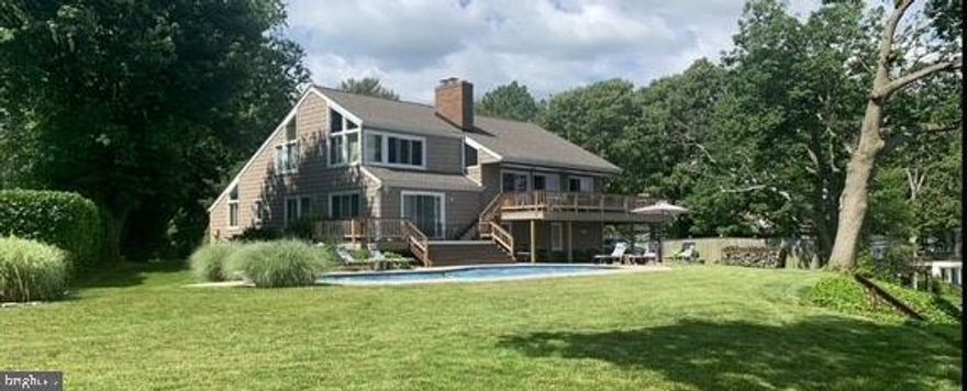 Waterfront Paradise!!!  Live like you are on vacation every day!  Swim in the inground pool, go boating on Bush River and enjoy the breathtaking views from a multi-level deck.  Sit by the built-in fire-pit on the new patio or visit the nearby Bush River Yacht Club, Otter Point or Flying Point Park.  Pier, boat lift, jet ski lift - it's all here!  Newer Bulkhead.  Enjoy this while your guests enjoy their own separate suite!  Custom built home with unparalleled views!  4 BR’s, 2 full and 2 half  baths.   Recently renovated kitchen and owner’s bath which has a cedar closet!  Your guests (or in-laws or nanny) have their own kitchen, Jack & Jill bath, LR and their own deck to enjoy the water views.  The loft can be used as an additional bedroom or an office - your choice.  The garage is oversized and there is plenty of additional parking.  The amenities of this house go on & on - vaulted ceilings, custom bar area with a beverage frig, water, microwave and a unique wine crate wall.  You truly have to see this one as it is genuinely beautiful inside and out!