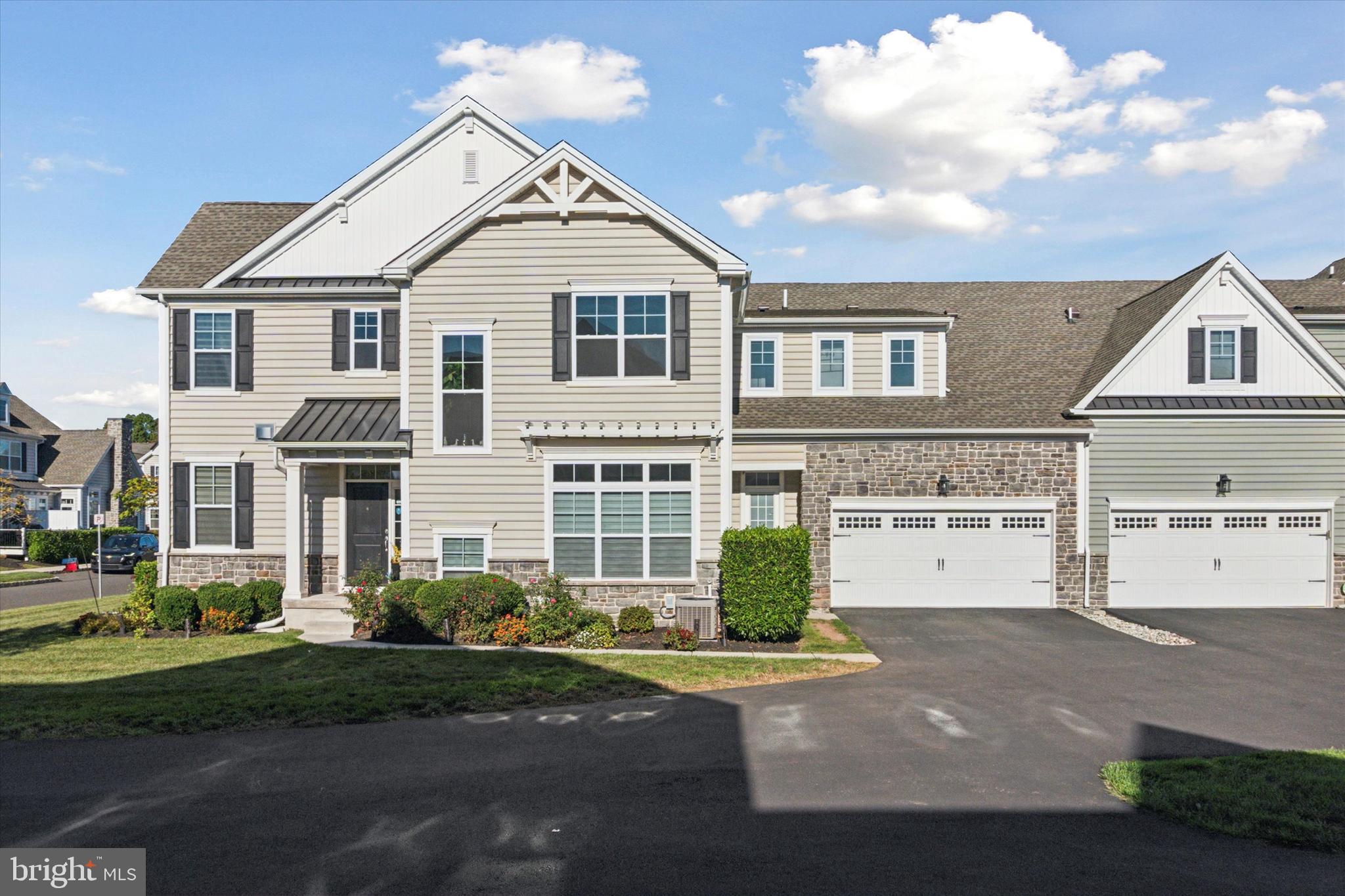 Goergous Carriage Home in Club View at Spring Ford. Built by builder W. B. Homes and is just minutes from Collegeville shopping, restaurants, Providence Town center, Philadelphia Premium Outlets, quaint Phoenixville, and of course the prestigious Springford Country Club for golfers. The first floor features dramatic 9' ceilings and a comfortable living open floor plan. As you enter through the foyer, you will be drawn to the gleaming hardwood floors and the custom oak staircase leading to the second floor. There is the gourmet kitchen featuring beautiful white Shaker style cabinets by Century Kitchens with soft close drawers and cabinets, adjustable shelves, and slide out base cabinets. The kitchen also features a very convenient center island with an overhanging breakfast bar. Additionally, there are stainless steel appliances. Directly adjacent to the kitchen is the spacious formal dining room which will be the perfect place to entertain your guests for a formal sit-down dinner and drinks. This open floor plan also features an adjoining family room and doors leading to the rear Trex which overlooks the walking trail and golf course. There is a FULL bath room off the kitchen. Onto the second floor you will find 4 bedrooms with 2 more full baths. The master bath is well laid out and features stunning ceramic tile floors and shower walls. The shower is oversized and features a glass enclosure. The home also boasts of an oversized two car garage. The development offers care-free living which includes total landscape maintenance, lawn care, and snow and trash removal. Easy to show.