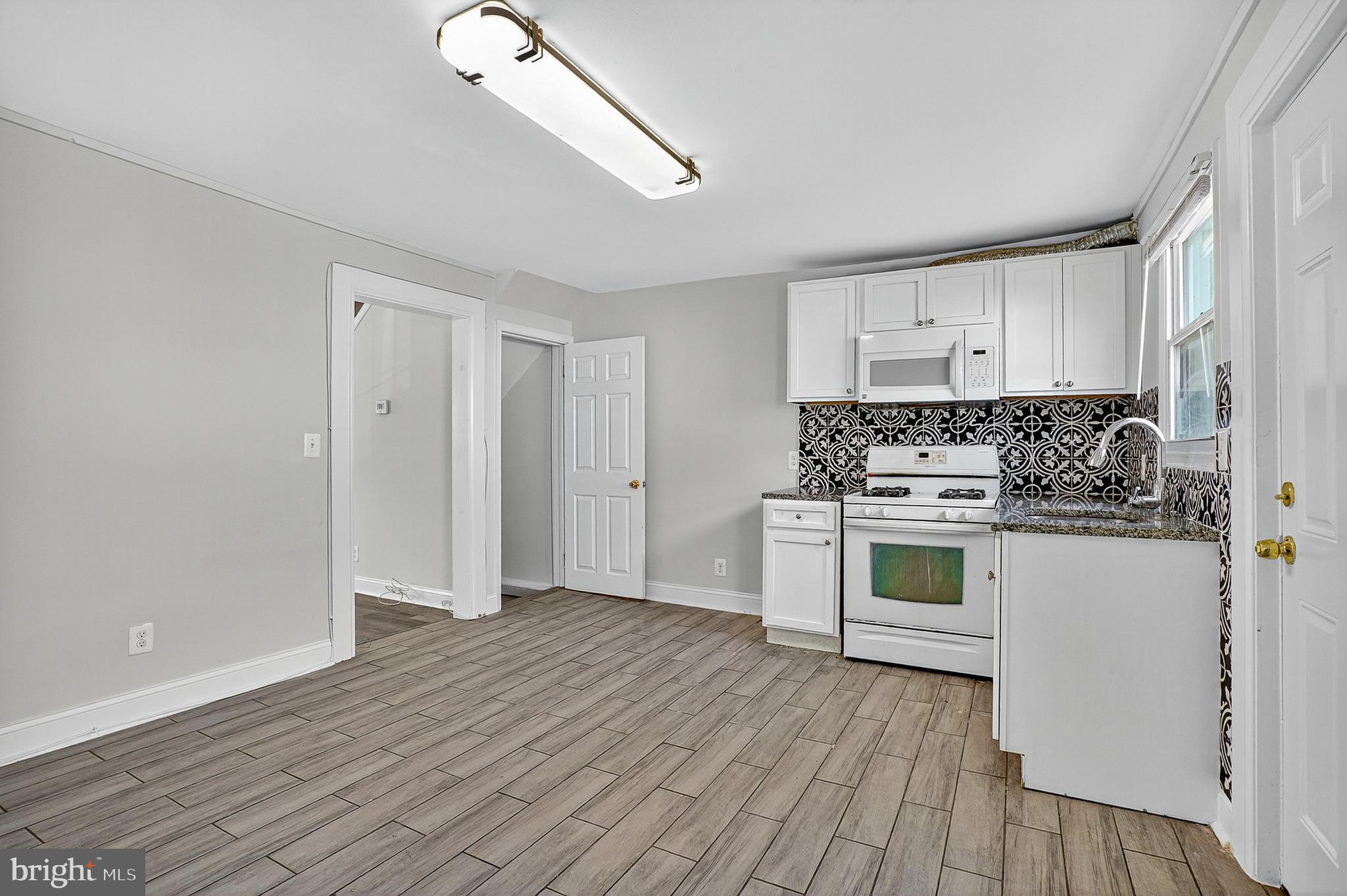Discover the perfect blend of affordability and potential in this 3-bedroom, 1-bathroom townhouse in Curtis Bay. Whether you're a first-time homebuyer searching for a place to call your own or an investor looking for a reliable addition to your portfolio, this property fits the bill. The home greets you with a bright and open floor plan on the main level, complemented by an efficient and well-equipped kitchen. The upstairs features two generously sized bedrooms with plush carpeting, ensuring comfort for the entire family. The full bathroom is modern and well-maintained. The finished basement offers valuable extra space for a variety of uses, from a cozy family room to a workshop. Outside, the fenced backyard provides a secluded space to unwind. The property's prime location in Curtis Bay places you close to parks, schools, and shopping, with easy commuting options. This is a rare opportunity to own a well-maintained home in a sought-after area at an unbeatable price.