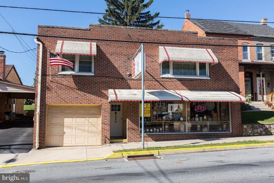 This Single Brick Mixed Use Property offers First Floor Commercial Space w/Retail Shop, Office/Work Shop and 3 Car Tandem Garage. 2nd Level is Spacious 2 Bedroom Residence. Perfect for In-Home Business or as rental units.