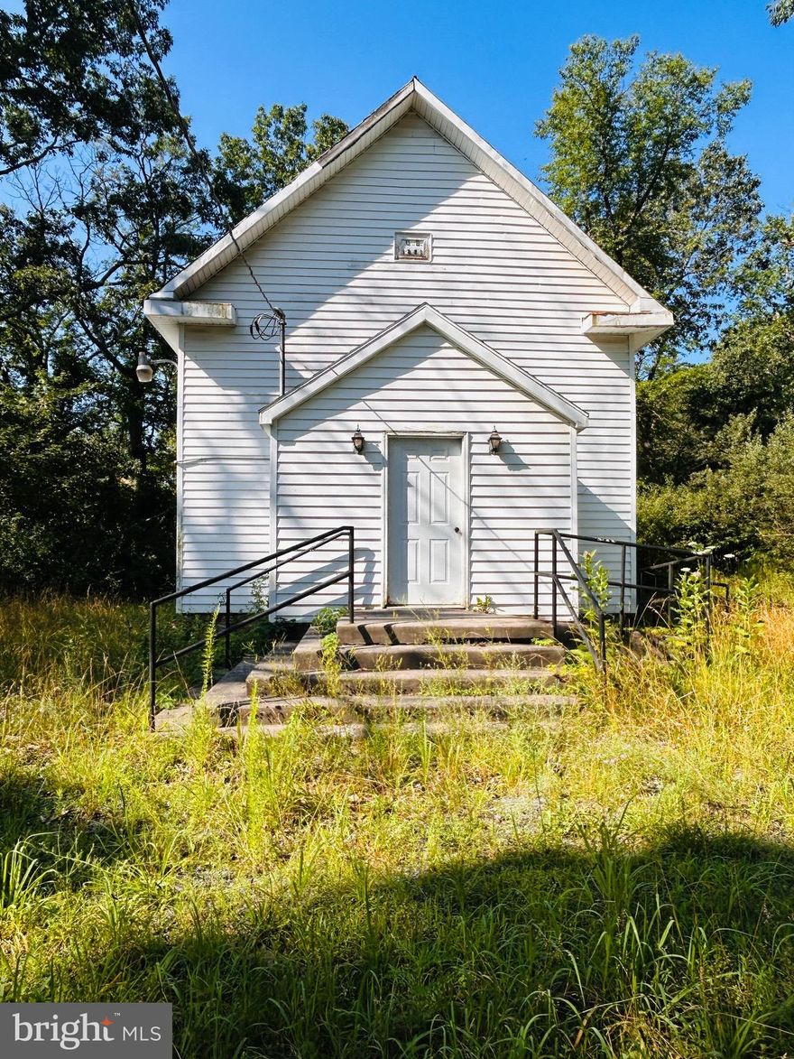 Charming 1881 Country Church on .884 Acres –  Sold As Is (All furniture and Fixtures sold with property except there is chimney for wood stove but stove is not included)

Step back in time with this unique opportunity to own a piece of history. Built in 1881, this charming country church sits peacefully on a newly surveyed .884-acre lot (survey completed April 2025). With its classic architecture and peaceful rural setting, the structure offers incredible potential for restoration, conversion, or preservation. Whether you're dreaming of a residential conversion, artist studio, or event space, this one-of-a-kind property provides a rare and inspiring canvas.

Electricity has already been run to the property but not turned on, making it easier to begin your renovation or conversion plans. Please note that there is no known well or septic system, and the current owner is unaware of any existing installations. Any buyer will be responsible for conducting a perc test and installing a well and septic system, if desired or required for future use.

This is an As Is sale, with no warranties expressed or implied. The property offers privacy, open space, and the charm of rural life, all while being within reasonable distance to nearby towns and roadways. Whether you're looking to preserve this historic structure or reimagine it for modern use, this property offers the foundation to bring your vision to life.

Don't miss this rare opportunity to own a piece of 19th-century architecture with potential limited only by your imagination.