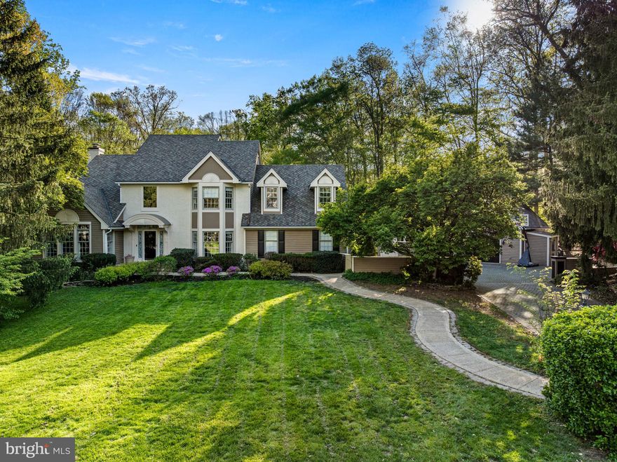 Situated on a quiet cul-de-sac, this rare Somerset Lake showpiece is set on an extraordinary 1.6-acre lot and delivers a private, resort-style setting with unmatched indoor and outdoor living—just a short walk to the community’s scenic 28-acre lake and clubhouse, where residents can enjoy a true lifestyle experience including kayaking, canoeing, rowing or morning workout in the exercise room all on Somerset Lake.
Welcome guests into a warm and inviting two-story foyer with a turned staircase and hardwood floors that flow throughout the main level. The formal living room features detailed wood inlays and a gas fireplace, while the formal dining room showcases elegant millwork—offering a sophisticated yet comfortable setting for entertaining. The bright, modern farmhouse-style eat-in kitchen is the heart of the home, featuring a center island, open shelving, recessed lighting, and a classic subway tile backsplash. High-end stainless steel appliances include a Viking 4-burner stove with griddle, Thermador refrigerator, and double ovens—perfect for everyday living and effortless entertaining. The kitchen opens to a step-down family room with a wood-burning fireplace and continues into a stunning sunroom overlooking the private backyard and pool area. Sliding glass doors lead to an expansive raised deck—ideal for outdoor dining and gatherings.
The upper level features a spacious primary suite complete with a walk-in closet and convenient laundry chute. The spa-inspired primary bath offers a double vanity, oversized jetted soaking tub, and an expansive dual-head walk-in shower—designed for both comfort and everyday luxury. Three additional generously sized, light-filled bedrooms and a beautifully updated hall bath complete this level, offering flexibility for family, guests, or a home office. The third-floor loft with a private balcony provides breathtaking views of the backyard and adds versatile bonus living space. A fully finished walk-out lower level is designed for both relaxation and entertaining, complete with a gas fireplace, wet bar, and full bath. Additional highlights include a pool house with a full bath and laundry, as well as a heated detached garage offering ample storage or the potential to be converted into a home office, studio, or workshop. Recent major updates include a new roof and skylights (2021), new hot water heater (2023), new furnace (2024), and new pool heater & pump, offering peace of mind for years to come. This one-of-a-kind property offers space, privacy, and lifestyle—an exceptional opportunity in Somerset Lake.