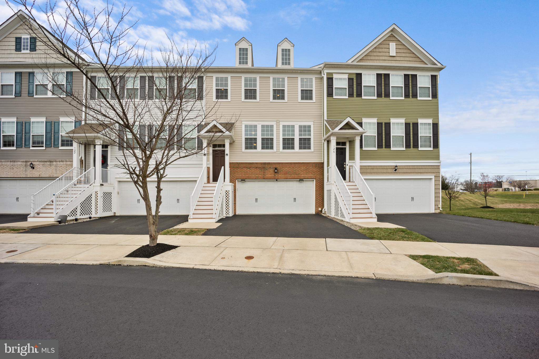 Welcome home to 124 Admiral Lane, the former model home with all the upgrades and the highly sought-after floor plan featuring the kitchen in the back, overlooking the trees. Enter through the covered front porch and admire the gleaming hardwood floors throughout, the spacious living room, and the combined dining/kitchen area. The kitchen offers a nice-sized pantry, an island with barstools, and all of the counters have an upgraded waterfall edge, plus a stylish backsplash and dining area that overlooks the large Trex deck with a patio set and grill. A powder room and storage closet finish off the main floor.
Upstairs, you'll find a primary suite with a private bathroom featuring dual vanities, and a large walk-in closet. Two additional nicely appointed bedrooms, another full bathroom, and a laundry closet/room complete the upper level.
Head down to the lower walk-out level and admire the gas fireplace, more hardwood floors, and sliding doors that access the patio. The lower level also features another half bath and access to the oversized garage with a designated storage area.
With plenty of storage, bedrooms, bathrooms, and flex spaces, tucked away between shopping and mature trees, plus being owned by just one owner and generously maintained, this never-before-offered home is ready for you to experience a little slice of Warrington Pointe. 124 Admiral Lane welcomes you home.