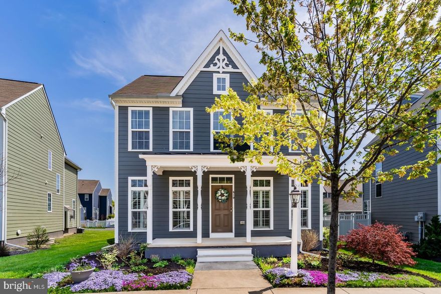 Welcome to this beautifully maintained home nestled in the sought-after Walden neighborhood, known for its tree-lined streets, walkability, and strong sense of community. Enjoy easy access to shopping, parks,  restaurants and a vibrant community center featuring a pool, community room and fitness center. Step inside to find hardwood flooring throughout the first floor, complemented by soaring 9ft ceilings and abundant natural light. A dedicated office with hardwoods offers the perfect space to work from home. The heart of the home is a gorgeous kitchen boasting white cabinetry, quartz countertops, a tiled backsplash, gas cooking, a spacious island, pantry, and recessed lighting—ideal for both everyday living and entertaining. Cozy up in the inviting living area featuring a gas fireplace with an accent wall and stylish plantation shutters. Upstairs, the generously sized primary ensuite includes a walk-in closet and a serene, private bath. The home is equipped with two zones for heating and cooling for year-round comfort. Outside, enjoy a fenced-in, landscaped yard complete with a stone patio and built-in fire pit—perfect for gathering with friends and family. A quaint front porch adds charm and curb appeal, while the 2-car attached garage with 10ft+ ceilings provides ample storage and convenience.  Solar panels on this home are on a Power Purchase Agreement. This home truly offers the best of comfort, style, and community living.