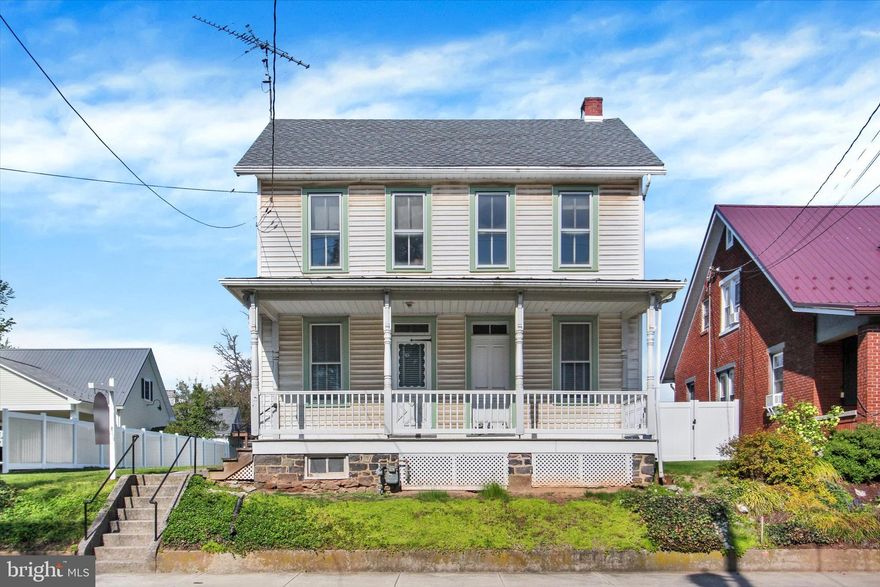 Classic circa-1900 home in historic Gettysburg, offering a rare restoration or investment opportunity.  Adored by the same family for generations, this 4 bedroom, 1.5 bath home features original character throughout, a separate dining area, and an enclosed back porch that adds flexible living or storage space.  The large, level yard provides ample outdoor potential, while the detached, two-story barn/garage with alley access offers off-street parking, workshop space, or future possibilities.  Conveniently located near downtown Gettysburg, this property is ideal for those looking to restore a piece of history or reimagine its potential.