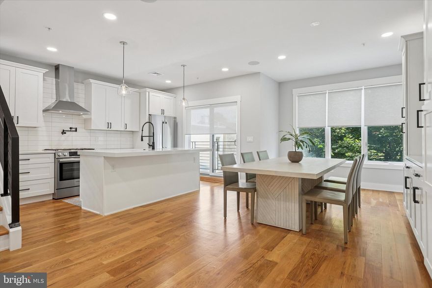 Drastic price improvement !! Motivated Seller !!  Welcome to 311 Delmar Street, a 2-year young luxury townhome with your dream finishes and amenities. This stunning home with attached oversized 1-car garage  with EV charger, features 4 Bedrooms and 4.5 Bathrooms in over 2​800 square feet of contemporary luxury space.  The first thing you’ll notice is the modern luxe façade, a well-designed combination of stone & wood with contrasting black accents.  Drive through the beautiful breezeway to access the garage, a feature that evokes a feeling of security, exclusivity, and privacy.  Inside, the design story is a perfect blend of crisp, modern lines and warm finishes which can be the ideal backdrop for a plethora of personal decorating styles.  Enter into a large foyer with dramatic 2-story ceilings. An adjacent open space + powder room provide a perfect welcome for guests.  Ascend to the fabulous open-concept living floor, complete with a huge living room, kitchen, and dining area that flow effortlessly with each other.   A gas fireplace with custom mantle and surround is the focal point of the living area.  A chef's eat-in kitchen with white shaker cabinetry, Bosch stainless steel appliances, pot filler, contemporary white quartz countertops and spacious island ideal for casual dining or entertaining. A wall of sliding glass doors leads out to a balcony with gorgeous leafy trees and skyline views. Large dining area with additional built-in cabinetry and serving area. Upstairs are 3 bedrooms and 3 full bathrooms. Primary Suite features a large bedroom with floor to ceiling sliding glass doors, giving an incredible skyline view from the Juliet balcony.  There is also a walk-in closet with custom built-ins​, a custom millwork feature wall, and a spa​ inspired en-suite bathroom complete with Radiant floors, oversized step-in shower with frameless glass doors, contemporary double vanity and a glamorous freestanding soaking tub in front of the window with tranquil views makes one feel as though you are in a luxury hotel suite. Convenient laundry room in the hall with side-by-side washer/dryer.  Next, you’ll find the Junior Suite with stunning natural light from the oversized windows, as well as an attached full bathroom with beautiful modern finishes.  Additional Guest Bedroom with a full bath in the hall complete this floor. From your oversized rooftop deck you will enjoy the incredible Center City skyline and sunset views perfect for entertaining. This will be THE place that everyone wants to gather for the warm weather festivities. Finished lower level is​ the 4th bedroom... great additional living space​ that is also ideal for a media room, home office, home gym, play room or guest quarters with full bathroom plus a spacious storage closet​. Throughout the home, you will be pleasantly surprised with the upgraded features such as: Sonos ceiling speakers on main floor, custom Hunter Douglas room darkening shades in all rooms, extra thick quartz island top w/ electric and seating for 4, a 5-burner gas stove w/ pot filler, black upgraded hardware throughout, tankless hot water heater, upgraded light fixtures, black iron stair railings, hardwood flooring throughout, wainscoting, roof top deck with electric and faucet, oversized garage w/ epoxy painted floors and EV charger, and coffee bar area in the hallway outside the bedrooms.  A truly well cared for, exceptional home built with only the highest quality building materials in a quiet, private location yet with easy access to Center City, transportation, major highways and the suburbs​! 8 years left on the valuable tax abatement! Delmar Place is a special collection of 3 custom city townhomes situated in a very desirable location high in the hills above Manayunk, with NO HOA fees.  Don't miss the video tour link.  Schedule a private tour today to experience the luxurious details of this unique home!