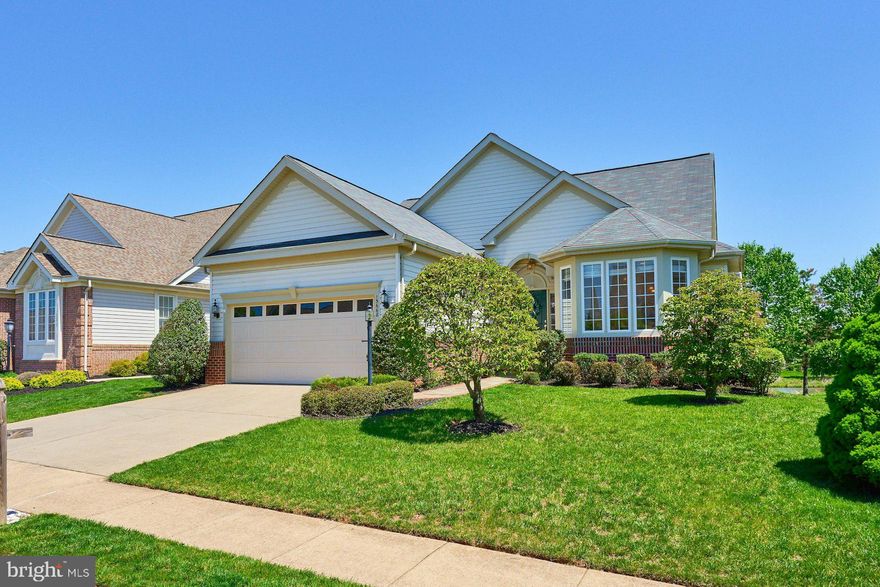 Come enjoy OPEN HOUSE Wine & Cheese Saturday May 3 from 12-2.  
Immaculate Oakleaf Model with Stunning Golf Course & Lake Views in Heritage Hunt
Welcome to this gorgeous brick-front Oakleaf model, perfectly situated in the highly sought-after Active Adult community of Heritage Hunt. With breathtaking views of the golf course and serene lake, this home offers an unbeatable combination of elegance, comfort, and tranquility.
Step inside to be greeted by gleaming hardwood floors and a soaring vaulted ceiling, adding to the home's spacious and airy feel.   All the hardwoods have been sanded and refinished.  The gourmet kitchen is a chef’s dream, featuring Granite countertops, Stainless Steel Appliances, and a cozy Breakfast Nook—perfect for morning coffee while enjoying the scenic surroundings. The formal dining room, illuminated by a stunning new and high end chandelier, flows effortlessly into the inviting Living Room, where a gas Fireplace creates a warm and welcoming ambiance.
The sunroom is a true highlight, opening to a rear wood deck with stunning views of the lake, golf course, and local wildlife. This outdoor space is ideal for relaxing, entertaining, or simply soaking in the peaceful atmosphere.
The primary suite is a private retreat, offering gorgeous lake views, new plush Carpeting, fresh paint, and two large closets. The en-suite spa-like primary bathroom boasts a Jacuzzi jetted Tub, elegant Marble Flooring, and an updated dual-sink Vanity. Two spacious secondary bedrooms, both with new Carpet, generous closets, and easy access to a beautifully updated hall Bath, provide comfort for guests or additional living space.
The fully finished lower level is truly exceptional, featuring brand-new upscale carpeting, full-sized windows, and a walkout to the lush backyard.  Painted in the designer color of Pale Oak, by Benjamin Moore,  this level includes a private fourth Bedroom and full Bathroom—perfect for guests or multi-generational living. A Wet Bar with a Wine Cooler and cabinetry makes entertaining effortless. Additionally, a large storage area with a built-in workbench and an extra bonus room offer flexible space for a home gym, hobby room, or additional storage.
Nestled on one of the most desirable lots in Heritage Hunt, this exquisite home delivers unparalleled views, luxury finishes, and a lifestyle of comfort and relaxation. Don't miss your chance to experience the best of golf course living in a premier active adult community!
The landscaped exterior has an inground irrigation system. Architectural Shingle Roof (2017). 
Heritage Hunt offers unparalleled amenities including golf, a Clubhouse, both indoor and outdoor pools, pickleball and bocce courts, and tennis courts, all ensuring a vibrant community life. Located conveniently near major commuting routes and the Virginia Gateway Center's shopping and dining. This Active Adult Community includes a Dining Restaurant & Bar at the clubhouse. This beautiful home is just a short distance from the Clubhouse, pools, and gym.

OPEN HOUSE WINE AND CHEESE, SATURDAY,  MAY 3RD from 12-2pm