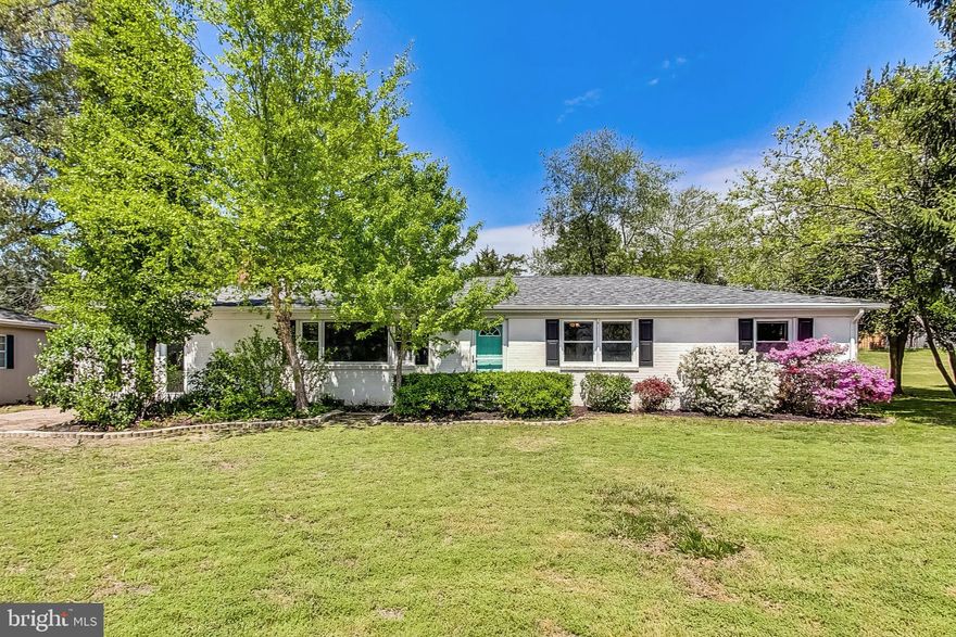 *OFFER DEADLINE Saturday, May 4th at 5:00pm* 
Welcome to your pastoral dream home! This charming ranch/rambler has comfortable single-floor living with three bedrooms and two bathrooms. Nestled on just under an acre lot, this property offers space and tranquility on a quiet street. As you step inside, you'll be greeted by an open concept living room, dining room and kitchen with fresh paint throughout the entire home. The living room has a wood-burning fireplace, creating a cozy and inviting atmosphere. The spacious living areas flow seamlessly, with a beautifully updated kitchen featuring granite countertops and stainless steel appliances, ideal for culinary enthusiasts and entertaining guests. In addition to the main living areas, this home has a bright and airy den, the perfect spot to relax and soak in the natural light all year-round or use it as a home office, play room, guest space, etc. The possibilities are endless! Outside, the expansive fenced-in backyard is a true gem, complete with a park-quality playset for endless outdoor fun. Beyond the fence line, you'll find additional land, offering  space for gardening, relaxation, or even potential expansion. The property also features a large detached garage for parking, storage, or a workshop for added convenience and flexibility. Additionally, a backyard shed conveys with the home, providing even more storage options. Seller purchased riding lawnmower that will convey with the sale, ensuring easy maintenance of your beautiful yard. Located just off of 301, this home combines the tranquility of rural living with the convenience of nearby city amenities. Don't miss out on this opportunity to make this house your home!

*sqft is estimated