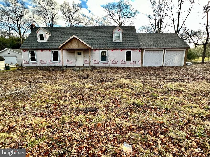 Beautiful cape cod with 2 car garage.  This home was riddled with termites when seller purchased it.  Sellers  has repaired all termite damage, poured a new concrete slab on first floor, replaced all wood on outside walls that was damaged, replaced all interior walls, replaced windows, new roof, removed stone on front wall (it's ready to be reinstalled).  The county stopped work because it wouldn't perc.