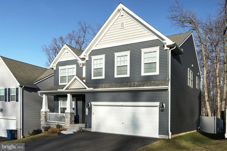 Available for quick move in!  You are going to love this 5 year young Keystone Custom Home, located in the sought after Red Lion community known as Kensington.  This 4 Br, 2.5 Ba, 2 Car garage single family home features a covered front porch, stone accent front foundation, cozy gas fireplace, GORGEOUS kitchen with farm sink, cabinets with crown molding, barn door covered (8 x 5) walk in pantry, custom backsplash, center island that is just shy of 8' in length, pendant lighting, gas stove with center griddle, (double oven) stainless steel appliances, (dish washer, microwave, refrigerator), built in hutch, 9' ceilings, Sunroom extension, coat peg and welcome bench mud /entry area, main level study/flex room, luxury vinyl plank flooring on the main level, exterior 14 x 8 wooden deck and privacy fenced back yard, gas connection for an exterior grill, WALK IN CLOSETS IN EVERY BEDROOM, ceiling fans in every bedroom, bedroom level laundry to include washer and dryer, Primary bathroom with free standing soaking tub and separate shower, Dual walk in closets (barn door) in the primary bedroom, partially improved  basement, gas heating, central AC, gas water heater and did we mention this home backs to trees/wooded area? Schedule your showing today!