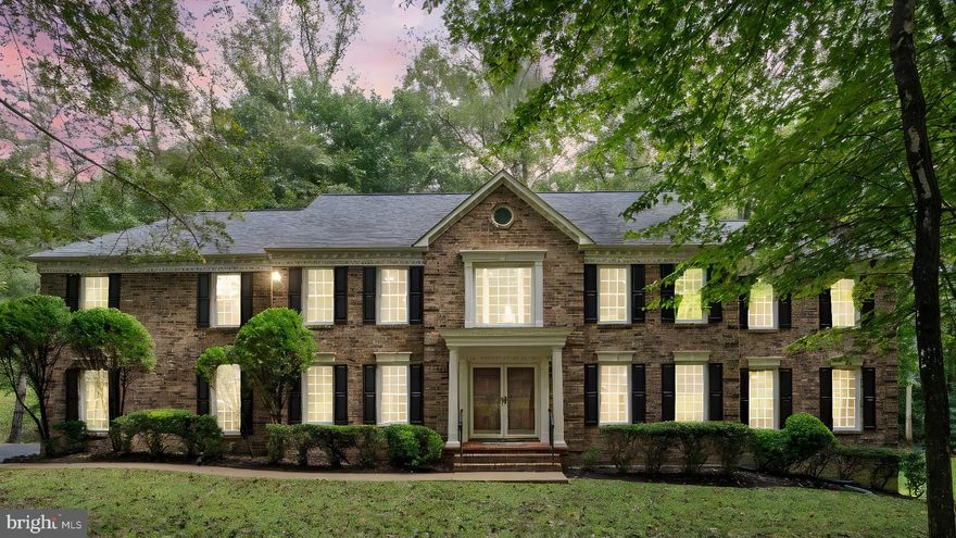 Welcome to 10201 Leatherleaf Court, a stately custom home tucked away on a 1.38-acre partially wooded lot offering both privacy and convenience with No HOA!  Designed with families and entertaining in mind, this expansive residence boasts over 5,500 square feet across three finished levels, filled with natural light and timeless details!  Hardwood floors and crown molding throughout main level, and the entry foyer, hallways, and dining room have additional elegant chair rail and shadow box molding.
The heart of the home is the gourmet kitchen, featuring custom wood cabinetry, stainless steel appliances, and a generous center island—perfect for family meals or hosting gatherings.  The kitchen flows seamlessly into the inviting family room with dramatic exposed beams on the ceiling, brick hearth and woodburning fireplace for cozy evenings at home.  You can enjoy formal occasions in the elegant dining room and formal living room.  The dedicated library/office  with Palladian window provides space for working or studying from home.
Upstairs, the expansive and luxurious owner’s suite includes separate sitting and dressing areas, creating a true private retreat.  The owner's bathroom has a double jacuzzi soaking tub, separate shower, and 2 brand new vanity sinks with new fixtures, lighting and mirrors.  The large walk in closet connects to the bathroom and to the dressing area, and has tons of room.  3 additional bedrooms upstairs and 2 more well-appointed bathrooms offer plenty of room for family and guests alike.  The upper level has another 5th flex room that could be used as a second office, play room, game room, or study.  Each of the large secondary bathrooms have double sink vanities and all  bathrooms have updated lighting fixtures.  All bedrooms have their own bathrooms, one is a Jack and Jill with the front and rear bedroom and the other has an ensuite bathroom with laundry chute that connects to the laundry  room on the main level.  All of the bedrooms are generous in size and have huge walk in closets, and new overhead fan light fixtures!
The finished lower level provides versatility with a huge recreation room, large 5th bedroom with multiple closets, a full bathroom, and 2 more bonus rooms ideal for a media room, playroom, or hobbies, ensuring space for everyone!  Outdoors, a spacious deck overlooks mature trees, offering a tranquil setting for cookouts, celebrations, or quiet evenings under the stars.  Additional features include a  2 car side-load garage, a whole house intercom system, alarm system, and thoughtful updates throughout!  Main level is equipped with a large laundry mud room, and a full bathroom with walk in shower stall.  The entire home has been freshly painted and has brand new carpet on the bedroom level and the family room on the main level. With its blend of comfortable family living and gracious entertaining spaces, this home is a rare find just minutes from Clifton, Fairfax, Manassas and major commuter routes.
*Brand New Roof in 2016 with 50 Year Architectural Shingles - with a Transferrable Warranty* Two Zone HVAC systems replaced in 2016 * New Hot Water Heater in 2023 * New Whole House Water Filtration and Softening System Installed in 2022,  *New Refrigerator 2023, *New Cooktop Installed 2025, *Brand New Carpet in Upper Levels in 2025, * Freshly Painted Interior 2025!  *New Garage Doors and Garage Door Openers 2025* Main level and Staircase have re-finished hardwood floors in great shape! * New lighting enhanced throughout the home, and updated bathrooms with new fixtures and elegant sink vanities.  Nothing left to do but move in!