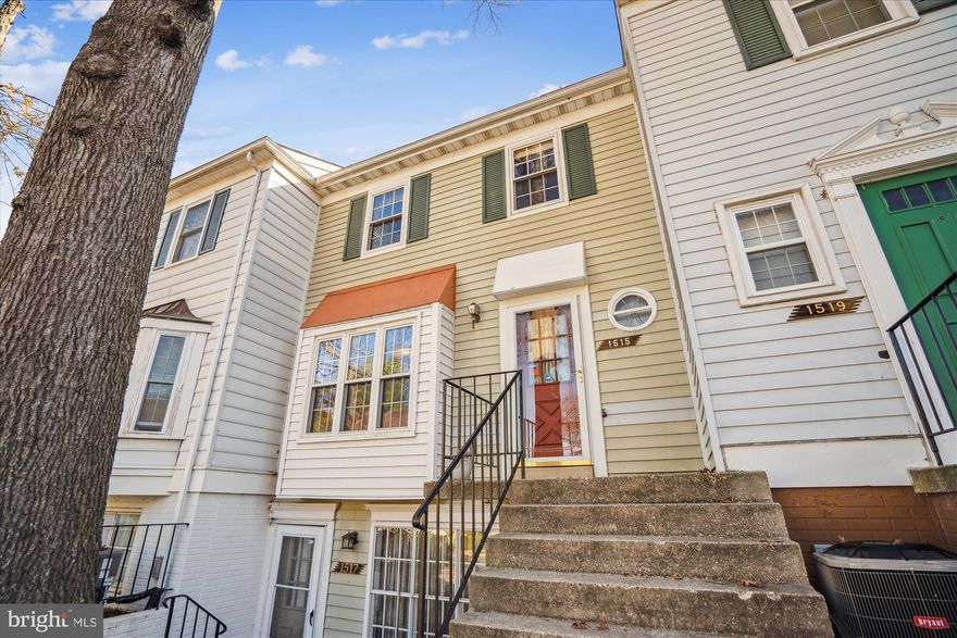 Welcome to this charming Crofton Mews home. The main level features a welcoming entry hall with durable vinyl flooring, a powder room with a new toilet (2024), and a well-equipped kitchen with dark cabinets, a brick accent backsplash, and appliances including a Maytag dishwasher and Whirlpool refrigerator. The sunlit living/dining room, with carpet and a wood-burning fireplace, provides access to the upper level. Upstairs, the primary bedroom includes dual closets, carpet, and an en-suite bath with a custom-tiled shower, tall vanity, and nickel hardware. Two additional bedrooms offer carpet, closets, and ample natural light, served by an updated hallway bath with a walk-in shower. The hallway also includes a laundry closet with shelving. The lower walkout level leads to a fully decked, fenced backyard with an outdoor storage shed. Exterior highlights include vinyl siding with a brick front, motion-detecting lights, an assigned parking spot, and a new HVAC system (2023). The condo association covers roof maintenance, annual termite inspections, and gutter cleaning, making this home a comfortable, low-maintenance choice in a prime location with easy access to Baltimore Washington International Airport, BW Parkway, and local shopping and dining.