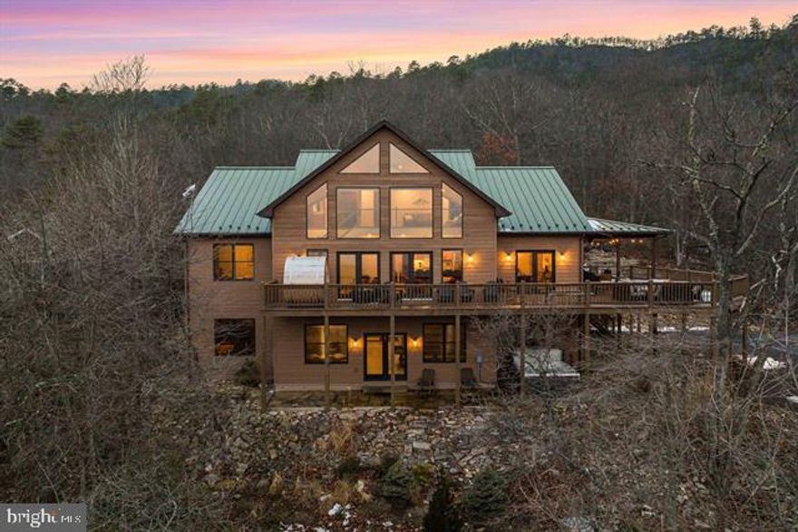 Welcome to an unparalleled luxury retreat nestled within Massanutten Resort. This exquisite custom home has been one of the top performing AIRBNBs in the region! Over $500,000 in INCOME in the past 24 months, this home is a true one of kind income producing asset. Professionally designed by Somerled designs, sold furnished, turnkey. A true masterpiece, it sits majestically atop an elevated vantage point, offering you the most breathtaking panoramic views of the Ski Slopes, Resort and Valley, a view that most can only dream of. The grandeur of this home is unmatched: cathedral ceilings lined with locally milled poplar and hardwood floors, dramatic views out every window. The open concept gourmet kitchen features custom hickory cabinetry & luxurious finishes & walk in pantry. All bathrooms feature ceramic tile floors, vanities with granite tops & glass shower doors, and the first-floor master includes a sauna. 6 Spacious bedrooms, 5.5 bathrooms. Over 1600 square feet of decking complete with Hot Tub, Barrel Sauna, privacy & incredible views. The Garage features an additional 760 sq ft of room to expand to a 7th/8th bedroom & additional amenity space! Inquire for full list of details. This is not just a home; this is a lifestyle!