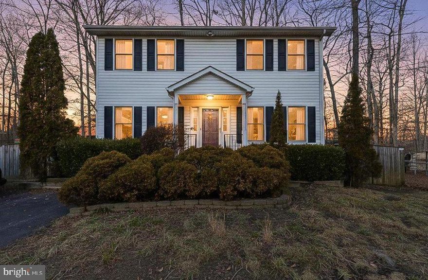 New to market - classic Colonial home offering three bedrooms, two and a half baths, and a well-designed layout filled with natural light. Hard-surface flooring runs throughout the home, creating a clean, cohesive feel from room to room. The kitchen features updated countertops, stainless steel appliances, and a double oven—ideal for everyday cooking and entertaining alike. Just off the kitchen, the deck provides seamless indoor-outdoor flow for grilling, casual gatherings, or winding down with an evening drink. Upstairs, the primary bedroom includes a private ensuite bath. Outside, a long driveway accommodates up to four vehicles, while the expansive, fully fenced backyard offers privacy and space for outdoor living.  *For added peace of mind, the seller is offering a one-year home warranty..*  Set in a quiet, scenic neighborhood along the Cleve Branch of Mill Creek, this home is just minutes from Lake Lariat Beach—an amenity exclusively available to residents of Chesapeake Ranch Estates. Looking for a home with room to grow, outdoor space, and surrounded by natural surroundings? Come see what makes this one special—schedule your tour today. ***See it before the snow at our OPEN HOUSE:  Saturday 1/24 from 12-3pm ***