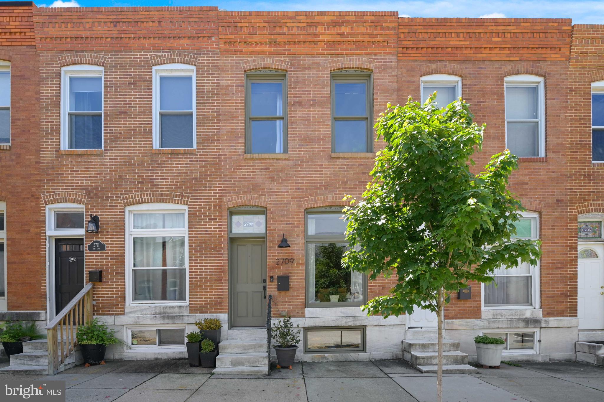 Gorgeous fully renovated 3 bedroom, 3 full bath home with parking pad in the heart of Canton! Open floor plan with exposed brick, stained glass transom, recessed lighting, dining area, hardwood floors, kitchen island with pendant lights, white cabinets, quartz counters and stainless steel refrigerator. Upper level with skylight and transoms above doors, hall bath with stand up shower, primary bedroom with en suite bath with whirlpool tub, second bedroom with door to lower deck and an amazing rooftop deck! This is the only home on the block with a rooftop deck so it is very private. Lower level is fully finished with a bedroom, full bath, additional living space and new washer and dryer. All levels, including the basement, have high ceilings through out. Schedule a tour today!