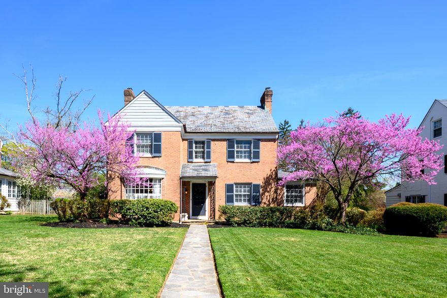 Welcome to 5409 Saint Albans Way, a charming brick colonial nestled in the heart of Baltimore’s prestigious Greater Homeland Historic District.
This 1946 classic offers timeless appeal and surprising spaciousness on a beautifully level, park-like lot—perfect for outdoor enjoyment with generous space to play or relax in both the front yard and the expansive, grassy backyard. The setting feels like a private retreat, yet you’re surrounded by Homeland’s signature tree-lined streets, Olmsted-inspired landscaping, and serene community lakes.
Step inside to discover a thoughtfully laid-out traditional floor plan with warm oak hardwood floors and abundant natural light. The gracious foyer welcomes you with a staircase leading to the upper levels. To the right, a cozy family room features built-in shelving and a gas fireplace—ideal for gatherings. Just beyond lies a bright, southern-facing room perfect as a playroom, home office, or sunlit den.
To the left of the foyer, the formal dining room showcases elegant built-ins and bathes in afternoon light. Adjacent is the updated kitchen, complete with thoughtful wine storage, a breakfast bar, and an eat-in area that captures glorious eastern morning sun—enhanced by stylish shutters. A convenient half bath sits at the rear, just steps from the covered stone patio that overlooks the peaceful, level backyard.
A detached two-car garage with convenient alley access completes the outdoor amenities.
Upstairs, you’ll find two secondary bedrooms sharing a full hallway bath, plus a generous primary suite with its own bathroom. The finished third-floor attic is a true bonus—offering a spacious main area, a separate nook ideal for a single bed or reading corner, and a full bathroom. This flexible space works beautifully as an additional bedroom, home office, or guest retreat.
The lower level features a finished side perfect for a media room, additional office, or comfortable lounge with space for a couch and TV. Another half bath adds convenience, while the opposite side provides ample storage and houses the utility area.
With approximately 2,659 square feet of living space, 4 bedrooms, and 3.5 bathrooms, this home blends classic Homeland character with practical, updated features. Enjoy the benefits of one of North Baltimore’s most sought-after communities—known for its historic charm, strong neighborhood association, and proximity to top schools, Belvedere Square, and city conveniences—all while living in a home that feels wonderfully deceptive in its generous scale and livability.
A rare opportunity to own a piece of Baltimore history in a setting that truly feels like home.