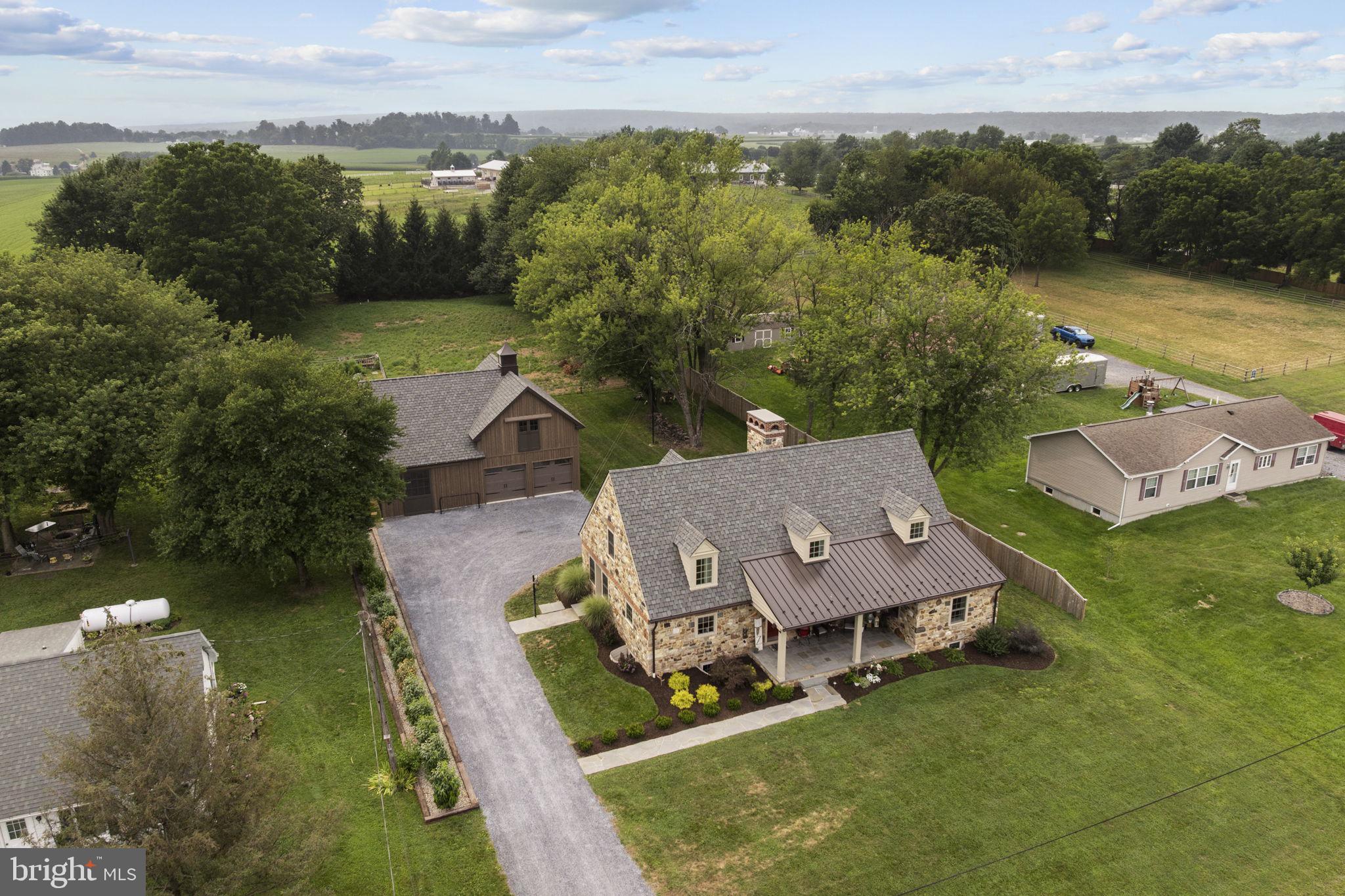 AUCTION PROPERTY. Auction date is Friday, October 24th @ 4PM. List price is opening bid price only and is not indicative of the final sale price. TERMS: 10% down day of auction, balance 60 days or before. Buyer pays both transfer taxes (2% of sale price). REAL ESTATE: Spacious 3 year old 1 ½ story stone cape cod w/2740 SF, custom eat-in kitchen, dining room, living/family room w/stone fireplace & vaulted ceiling, 4 bedrooms (1st floor bedroom), 2 ½ baths & laundry/mud room. SPECIAL FEATURES: Granite kitchen tops, panel doors, colonial/custom trim, full basement w/future family & rec rooms w/stone FP, high ceiling, canning room, LP gas Hot Water radiant floor heat & complete solar panel system. OUTBUILDINGS: 1 ½ story 32X42 barn/garage w/2 horse stalls, 2 car garage 2w/full 2nd floor 26X42 storage area & greenhouse all on level 1 ACRE lot w/1/2 fenced pasture, lawn & garden area, on-site, on-site well & septic system. NOTE: Owners are relocating & serious to sell. Absolute custom house & barn/garage designed by renowned architect Richard Buchanan, all only 3 years old. Move in condition & custom features galore. Economical w/ complete solar panel system. Ideal location. Farmland view. A must see property. OPEN HOUSE DATES: Saturday, October 4, 11 & 18 from 1 to 4PM.