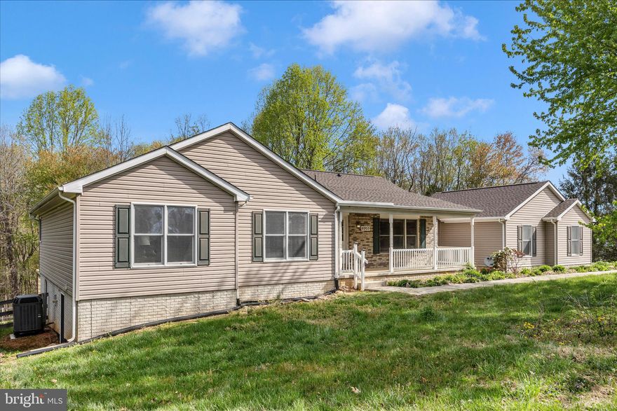 This is the farmette you have been waiting for!!! You just have to wait a little longer until April 10th when the home goes active!  Wonderfully updated ranch home with direct access to Patuxent State Park for hiking, horseback riding or biking! The home is perfectly situated to provide beautiful views of the property and your own creek! Enjoy the open concept kitchen and family room with wood burning fireplace.  On the main level is the master bedroom with private full  bathroom, two additional bedrooms that share a full bathroom and a half bath. The walk out basement was completely renovated to include 2 bedrooms, a full bathroom, office, woodstove, and full kitchen! Use this space as an in-law apartment or keep the space for yourself and use the kitchen as a bar area! Two car sideload garage equipped with EV charger. Off the back of the home is the newly finished deck with composite decking, patio and water feature!  Enjoy the park like setting of over 27 acres.  Directly behind the home is a fenced paddock with a barn suitable for horses, cows, goats, sheep... There is approximately 12 acres of open pasture that is fenced. There are paths through the wooded area that lead to your own creek. One of the best features of the property is direct access to Patuxent State Park with miles of trails for hiking, biking and horseback riding!