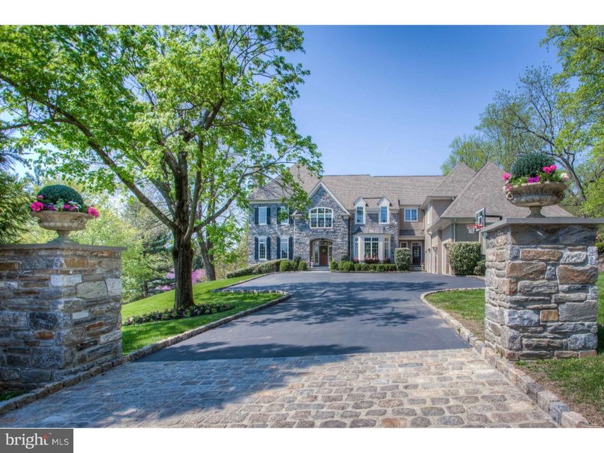 Exquisite 10 year old stone colonial that truly will take your breath away!! It is not just a new house, but one that has been refined by its current owners with magnificent finishes and upgrades that put in a class of its own. The stone pillars at the end of the driveway set the tone of this exceptional property and its classic elegance continues as one enters the beautiful front to back Foyer that gracefully opens to both the Living and Dining Rooms. The Dining Room is a masterpiece with millwork right out of architectural digest and expansive windows providing streaming natural sunlight. The soothing Living Room with gas fireplace and deep window sills gracefully flows into the handsome Library and formal Powder Room with custom vanity. 11 foot ceilings and gleaming hardwood floors continue into the gourmet Kitchen that is a chefs dream with a magnificent floor to ceiling cabinetry,an oversized marble topped Island, and brand new high end stainless steel appliances,including a Sub Zero refrigerator, Wolf gas cooktop, double ovens and warming tray. The open floor plan continues into the Breakfast Area into the breathtaking Great Room with a soaring coffered ceiling,stone gas fireplace and exceptional millwork... while capturing the gorgeous private backyard setting complete with pool and beautiful flagstone patio that runs the length of the back of the house. The first floor is completed by an informal Powder Room that conveniently can be found off of the Mudroom and three car attached Garage. A gracious staircase leads one to the Second Floor where there is a magnificent Master Suite with custom beamed ceiling, Master Bath and a walk in closet that defines pure luxury. An expansive hallway leads one to two additional Bedrooms and hall bath. There are two additional Bedrooms both with en suite Bathrooms that are conveniently located off of the backstairs. The finished Lower Level is streaming with natural sunlight through a wall of windows. Don't miss this very special home in Radnor Township.... attention to detail is better than most model homes and stunning decor is a true treat to see!!