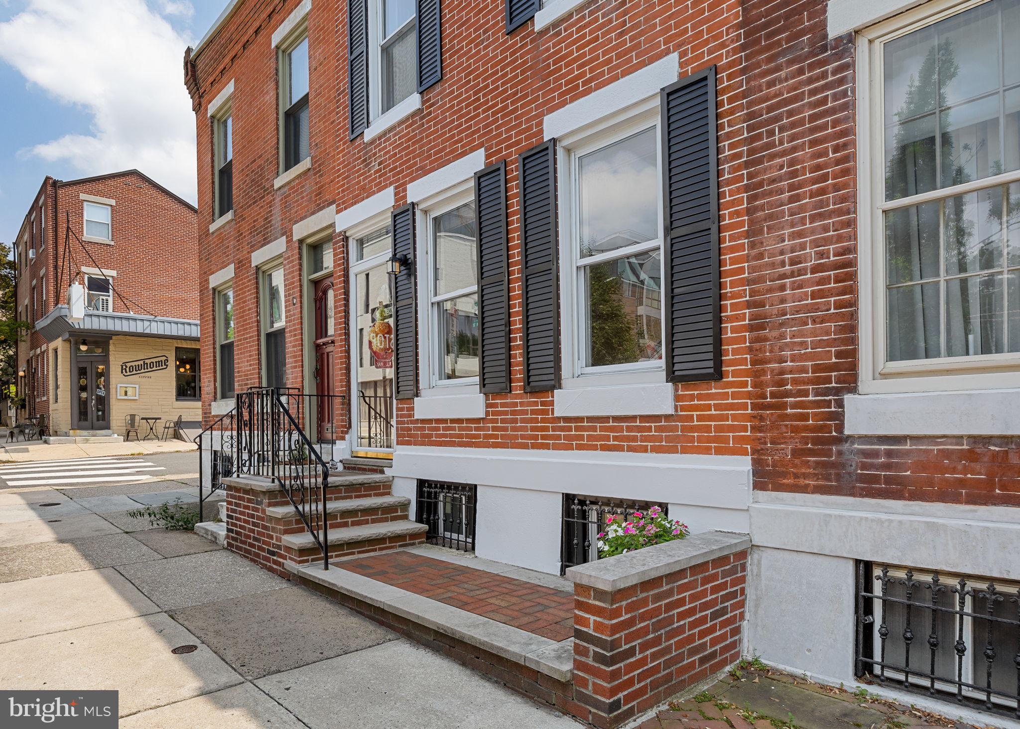 Perfectly positioned in one of Philadelphia’s most sought-after neighborhoods, 2602 Pine Street is a rare offering. A lovingly maintained townhome that sits directly across from the tennis courts and just steps from Fitler Square Park, the Schuylkill River Trail & Dog Park, and Markward Playground. Set in the Greenfield School catchment and surrounded by charm, this home blends warmth, space, and location in a way that rarely comes to market. The home’s timeless red brick façade, accented by crisp white lintels and classic black shutters, offers a warm welcome that reflects the charm found inside. Inside, you're welcomed by a warm and inviting living room anchored by a fireplace- ideal for cozy nights in. Hardwood floors and soft natural light create an inviting backdrop, while an oversized coat closet offers practical storage without compromising style. The sun-drenched eat-in kitchen is the heart of the home, offering generous cabinet space, room for a dining table, and a windowed sink that looks out onto a large private patio. Whether you're sipping morning coffee or hosting dinner al fresco, the indoor-outdoor connection feels seamless and serene. Upstairs, the second floor features three generously sized bedrooms, each with ample closet space and room to accommodate everything from kids’ rooms to a home office. The hallway bath includes a classic tub/shower combo and single-sink vanity. The recently finished basement is a true bonus: with recessed lighting, durable flooring, and a clean, open layout, it's perfect as a playroom, office, guest suite, or fitness area. A second full bathroom with a stall shower, side-by-side washer and dryer, and built-in storage completes the lower level, making everyday life as comfortable as it is convenient. Beyond the home itself, the location is exceptional. Walk to 30th Street Station, CHOP, Penn, and the entire University City corridor with ease. Rittenhouse Square and some of Philadelphia’s best dining, shopping, and cafés are just a short stroll away. At 2602 Pine, the very best of city living is right outside your door.
