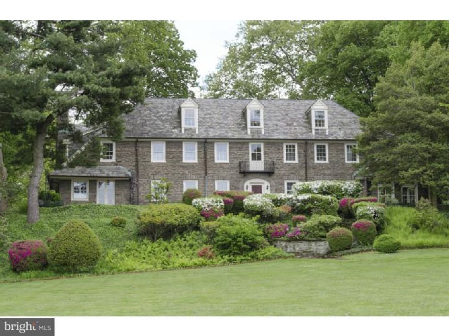 In the 1910's and 1920's, Americans discovered Europe and fell in love with its architecture, especially the traditional houses of the French and English countrysides.  This gorgeous 1925 Chestnut Hill home represents a happy marriage of elegant French style and the finest local building materials, brought together by a talented Philadelphia architect.  The setting is exquisite - 2.5 acres of sweeping lawns, flowering shrubs and mature trees, with front and rear patios & balconies to enjoy the views.  The house offers many fine interior and exterior details, including 4 marble fireplaces, antique wood paneling in the family room, multiple French doors, random-width pegged oak floors, the original slate roof, and all-stone construction.  On the first floor are a center hall; large, elegant living room; formal dining room; sun room; large eat-in kitchen with wood cabinets, granite counters & stainless steel appliances; a library/family room; laundry; and powder room.  The second floor has 4 spacious bedrooms and 2 full baths, including a very large master bedroom with office/dressing room and ceramic tile bath.  There are 2 more bedrooms and a full bath on the third floor, and a large play room in the basement.  The property includes a detached garage with wonderful 1-bedroom 1-bath apartment, offering many possibilities for guests, an au pair, or secluded office or studio space.  An extraordinary property, not to be missed! Please DO NOT drive down driveway without appointment.