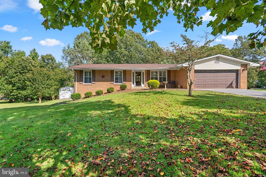 Buyers got cold feet. Their loss is your gain. $5000 price reduction. Septic will get a new distribution box and risers as suggested by septic inspection. Roof less then 2 years old. HVAC less the 2 years old This brick rancher is set on a beautiful 1-acre lot in the heart of Calvert County.  Offering 4 bedrooms and 3 full bathrooms, this home offers an abundance of space.  Inside you'll find the entire main level with beautiful hardwood floors, offering formal living and dining rooms, a family room with a charming wood burning fireplace with brick hearth, and three bedrooms plus two full bathrooms, including one en-suite bedroom with full bath.  The finished lower level offers LVP floors throughout, no carpets!  The lower level offers a primary suite, complete with a generously sized walk-in closet and a newly updated, spa-like bathroom, and also boasts a spacious living area with built in shelving and cabinetry.  There is also a convenient laundry room area with tons of storage space.  The property also offers a large 2-car garage, and a blacktop driveway with ample parking space. If outdoor entertaining is your preference, you'll be delighted to find a screened porch and a huge deck! Multiple sheds for storage.  Come make this beautiful home your dream home! House is in beautiful condition but seller is selling AS/IS