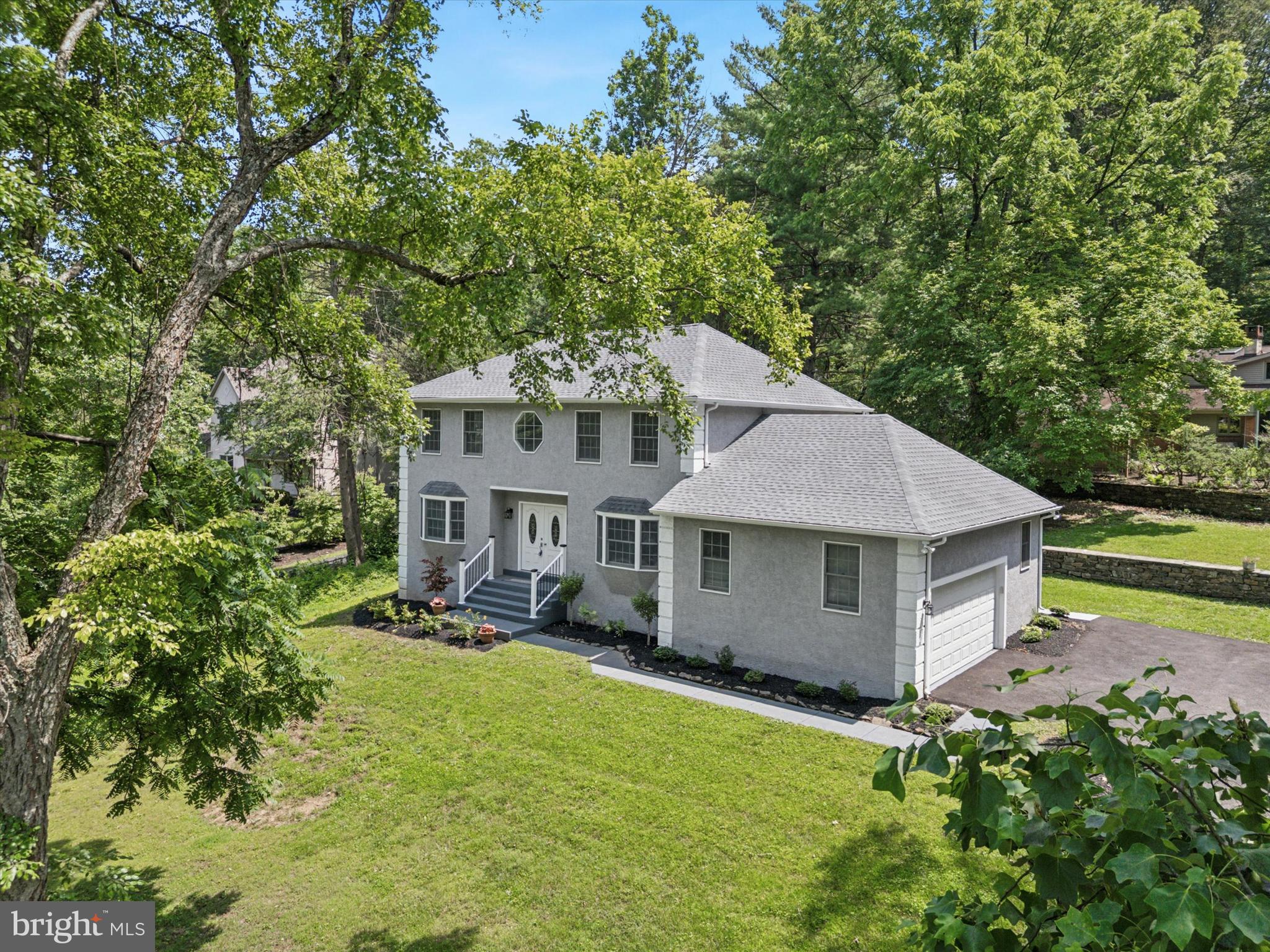 An exquisite retreat in the prestigious Wissahickon Park G neighborhood in Lafayette Hill. 918 Andorra is a fully renovated, modern luxury home, approximately 2,600 SQFT of finished space, with 4 bedrooms, 2.5 baths, Laundry Room, Deck, and approximately 1,200 sq. ft of unfinished basement for storage or future expansion. With Wissahickon Valley Park in its backyard , this home blends modern luxury and timeless elegance, surrounded by nature and privacy.
Renovated in 2024, the owners invested in upgrades and attention to detail. Stunning wide-plank Waterproof floors greet you in the foyer, which flows into an elegant Dining Room on one side, a bright First Floor Bedroom/Office on the other side, Chef’s Kitchen, Living room with a fireplace, and sliding doors to a private deck and backyard—perfect for entertaining.
The Chef’s Kitchen features two-toned cabinets, stainless steel appliances, Calcutta Quartz countertops, and a large island. It opens to a Breakfast area and Family Room with stunning views of the private deck and backyard. On the other side of this stunning kitchen leads to a dedicated Laundry Room with sink, powder room, and an attached two car garage.
Upstairs, the luxurious owner’s suite offers a tray ceiling, walk-in closet, and a spa-like bathroom with a jacuzzi tub, dual vanities, and tiled shower. Two additional bedrooms with closets and hall bath complete this floor.
The huge basement has waterproof floors and is ready to be finished for additional living space. Outdoors, enjoy a private deck and backyard with passage access to an additional lot which can be used to build a tennis court or a huge play area with a swing set.
Located within close proximity Chestnut Hill shopping and restaurants, two Septa train stations to Center City, Philadelphia and 52 miles of trails in the Wissahickon Park.
918 Andorra is more than a home—it’s a lifestyle. Schedule your private showing today!
Floor Plans and Site plans are in the photos.