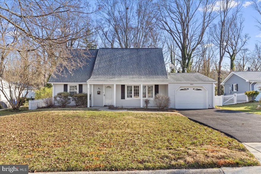 This is what you have been waiting for!  A great cape cod home that is in move in condition!  Newer Carrier heat pump, stainless appliances, granite counter tops, Sun Setter Awning over the deck, roof is in good shape, fenced back yard and new sewer lines have even been done!  There is a large vaulted ceiling addition on the back of the house with skylights and a fire place and tons of natural light.  Big wide driveway and one car garage make it easy to park.  There are two bedrooms on the main level and a full bath and the upper level features 2 huge bedrooms and a full bath. Laminate wood flooring on main level and carpeted upstairs.  Sellers understand that you will want to do some updating so they have priced it accordingly.  Great for a scale down home or your first purchase!  It's in the great  well maintained community of Bowie.  House backs to woods for nice privacy. As Is Sellers want to sell in AS IS condition , but  are not aware of any items that are not in working order.