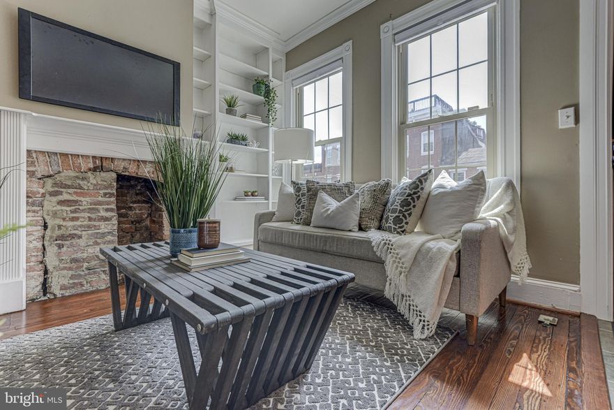 *4 Car Parking.  This end unit features exposed brick, unbelievable island kitchen w/ granite counters, ss appliances, & tile backsplash, main level half bath. The master has separate vanities and a HUGE walk in closet.  Take some time on a nice evening and relax on the private balcony.  When entertaining, you have room to fit 4+ cars in your private off street lot.  Close to all Riverside, Locust Point and Federal Hill have to offer.  Partially finished basement being used as a 3rd bedroom.  This one has it all!