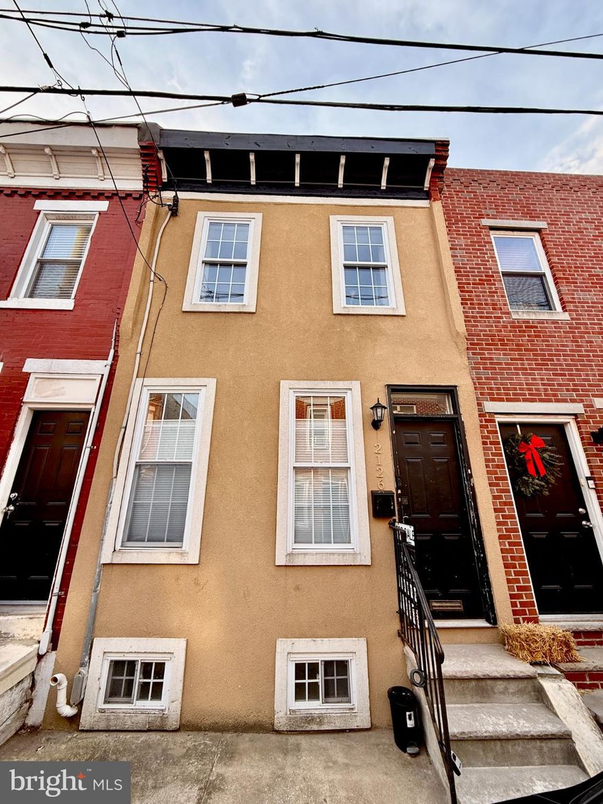 Welcome to this quintessential 3-bedroom, 1-bathroom row home located in the heart of the vibrant Point Breeze neighborhood. Perfectly situated just minutes from Center City, this home has great natural light and offers updated appliances within. Step inside to a bright, open-concept living and dining area featuring hardwood floors and new paint. The kitchen, complete with nearly new appliances (Microwave - Dec 2025, Stove - Sep 2024, Fridge - Aug 2024) boasts plenty of counter space to cook and entertain. Off the kitchen is a door which leads directly to a private rear patio. It’s ideal for summer grilling or a container garden. Upstairs, you'll find three bedrooms, each with great natural light and a full closet. You will also find the full bathroom on the 2nd floor. The finished basement offers a great flex space for a home office, craft or theater room, or beyond! The washer/dryer in the utility room of the basement is smart and all-in-one! No more running up and down to swap the clothes!

With a Walk Score of 81, you are steps away from neighborhood favorites like American Sardine Bar, South Philly Tap Room, and the O.G. Porco’s Porchetteria. Whether you're a first-time homebuyer looking for an accessible entry into the market or an investor seeking a high-demand rental, this property is a standout.

• Key Features: Private outdoor space, laundry in-unit, finished basement.

• Location: Easy access to the Broad Street Line and Washington Avenue bike lanes.