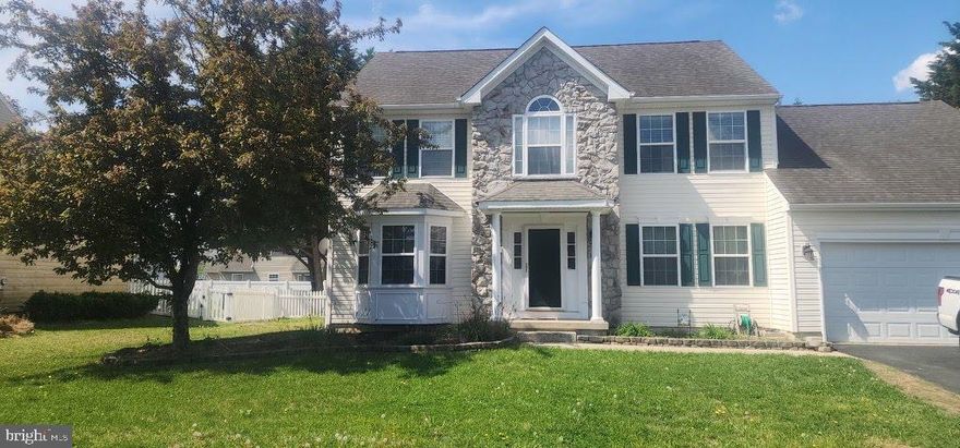 Rare "Re-freshed" 4/5 bedroom colonial on premium corner lot!  This stunning stone front colonial is move in ready!  Located in highly sought after Garrison's Lake Green.  This home offers a perfect blend of traditional elegance and modern flexibility.   
The first floor room is perfect for the 5th bedroom/guestroom, office or hobby room.  Gleaming hardwood floors throughout the majority of the main level, accented by classic crown moldings and chair rails.   
A chef's kitchen features a large center island, pantry and sun filled breakfast area- perfect for entertaining.
Outside living is just a step out from the kitchen- large deck overlooks a fully fenced rear yard- a perfect oasis.
A massive unfinished full basement with windows means endless options to grow!

2/1 buy down available- beginning interest for conventional loan 4.5%
