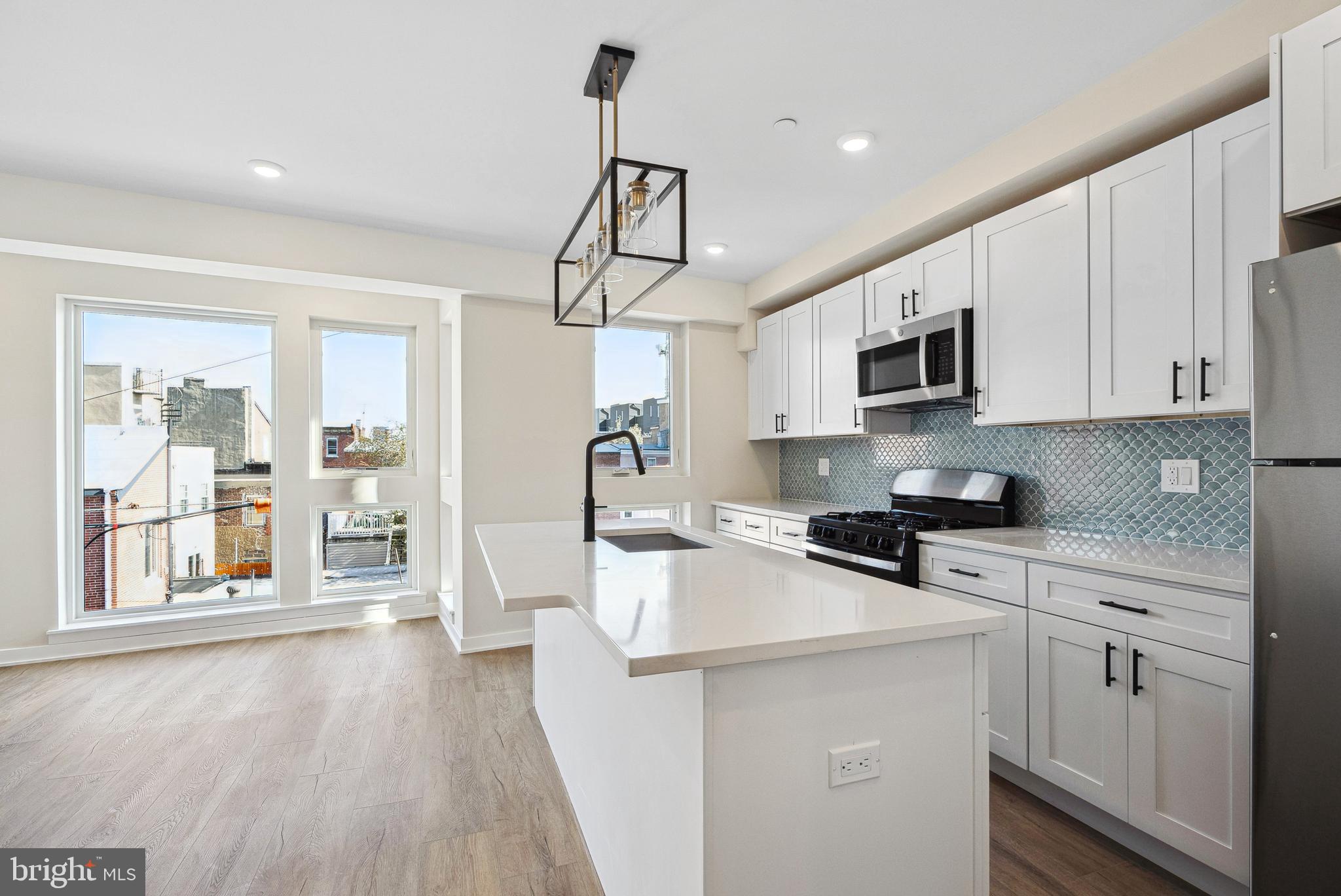Welcome to 138 Tasker St, a brand-new construction building offering modern living at its finest. This beautifully designed unit features a spacious layout, hardwood floors, and high-end stainless steel appliances—including an in-unit washer/dryer, dishwasher, garbage disposal, microwave, and oven/stove. Enjoy sleek, contemporary bathrooms, and large windows throughout the unit that bring in abundant natural light, creating a warm and inviting atmosphere. You are just steps from Dickinson Square Park and the Delaware River Waterfront, as well as tons of vibrant cafes and restaurants. Parking is available for just $150/month, a convenient price with I-95 just a few minutes drive away. Pets are welcome—cats with a one-time $350 non-refundable fee, and dogs with a $500 non-refundable fee (size and breed restrictions apply). Don’t miss the opportunity to live in one of Philly’s most desirable neighborhoods!