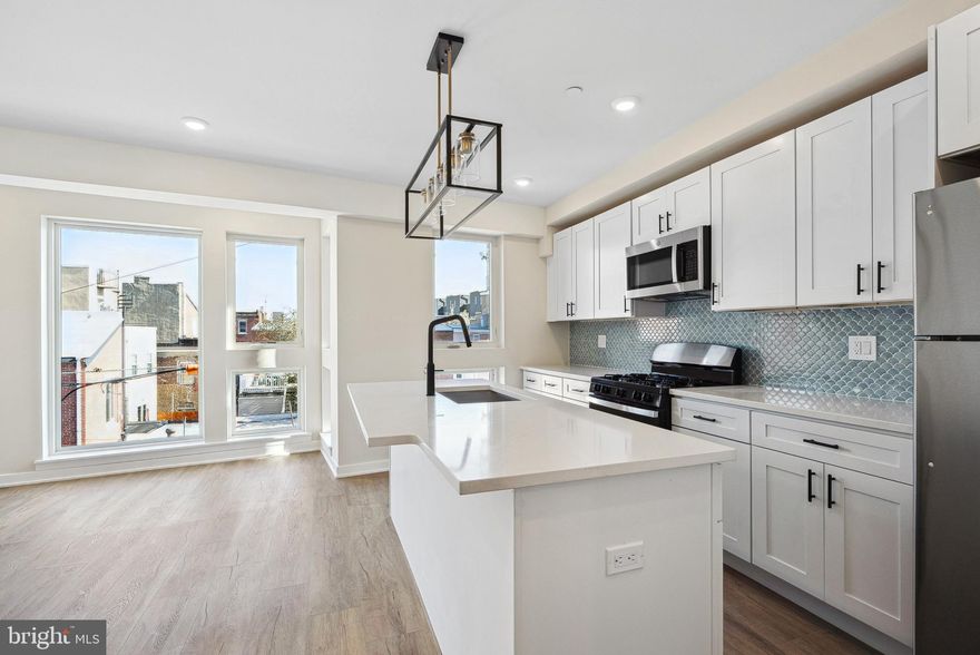 Welcome to 138 Tasker St, a brand-new construction building offering modern living at its finest. This beautifully designed unit features a spacious layout, hardwood floors, and high-end stainless steel appliances—including an in-unit washer/dryer, dishwasher, garbage disposal, microwave, and oven/stove. Enjoy sleek, contemporary bathrooms, and large windows throughout the unit that bring in abundant natural light, creating a warm and inviting atmosphere.  You are just steps from Dickinson Square Park and the Delaware River Waterfront, as well as tons of vibrant cafes and restaurants. Parking is available for just $150/month, a convenient price with I-95 just a few minutes drive away. Pets are welcome—cats with a one-time $350 non-refundable fee, and dogs with a $500 non-refundable fee (size and breed restrictions apply). Don’t miss the opportunity to live in one of Philly’s most desirable neighborhoods!