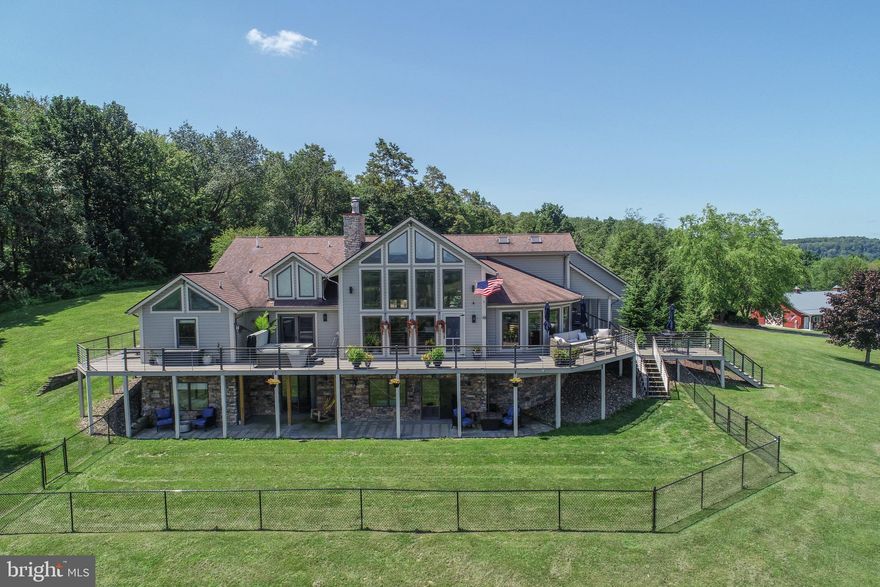 Perched on 16±/- private acres with sweeping, panoramic mountain views stretching into Pennsylvania and West Virginia, this custom hilltop estate offers the perfect blend of luxury and privacy. Designed with both comfort and craftsmanship in mind, the home features a gourmet kitchen with Viking appliances, radiant floor heat, two fireplaces, and thoughtfully curated finishes throughout.

The spacious layout includes 4 bedrooms, 3 full baths, and 2 half baths, offering room to gather and retreat. A 2-car attached garage is complemented by an impressive 40’ x 80’ detached shop/garage complete with finished “man-cave” space—ideal for hobbies, entertaining, or additional storage. A whole-house generator provides added peace of mind.

Enjoy tranquil rural living just 15 minutes from Deep Creek Lake and Wisp Resort—where refined mountain living meets convenience.