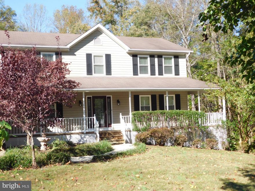 Beautiful, well built, spacious home on almost two acres with a private fenced back yard.  Close to Prince Frederick, easy commute to Pax River or Andrews and many other destinations, DC, VA,  and more.  Large updated kitchen with new stainless appliances.  Newly refinished beautiful hardwood floors throughout the main and upper levels of this large home.  The carpet is brand new.  Large wrap-around porch, and a large rear deck.  NO HOA.  You'll love the location and the privacy.  This home will not last long.  Master bedroom with walk-in closet with built-in shelving, also has a large walk-in shower with a bench, dual vanities too.  Water heater and one of the two A/C units under five years old.  Windows have a lifetime guarantee.  Large living room with hardwood floors, large dining room with hardwood floors and french doors to the wrap-around deck, chair rail,  and crown molding.  Large family room off of the large kitchen with a beautiful brick surround fireplace with built-in bookshelves and french doors to the large deck.  Nicely finished basement with new carpet and a newly renovated full bath, and the basement is huge adding 1660 square feet to the upper two levels of 2,848 square feet for a total of 4,508 square feet.  Also, the basement could be a potential income producing rental with a full bath and a separate entrance or in-law suite.  New smoke/carbon monoxide detectors, new exterior lights around garage doors, front door, and basement door.  New garbage disposal too.
