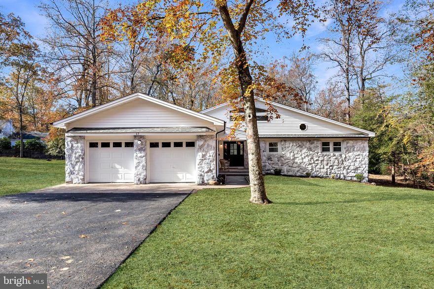 Natural Light Meets Modern Elegance. Prepare to be wowed by this stunningly reimagined 4-bedroom, 2.5-bathroom ranch with 2 car garage in the heart of Medford NJ. No detail has been spared in this top-to-bottom renovation, featuring a new roof, siding, windows, HVAC, and designer finishes throughout.
The heart of the home is a massive two-story great room bathed in sunlight, thanks to a soaring ceiling, oversized picture window and 10+ skylights. The open-concept layout flows seamlessly into a chef’s dream kitchen, complete with custom cabinetry, crisp white quartz countertops, a feature wine rack, and premium stainless steel appliances. Retreat to the owner’s suite, which offers private backyard access and a spa-like ensuite featuring an oversized custom tile shower and a deep soaking tub. Outside, your private oasis awaits: a cleared, graded lot backing up to a tranquil, winding stream. With every major system updated and aesthetic perfection achieved, the only thing left to do is move in.