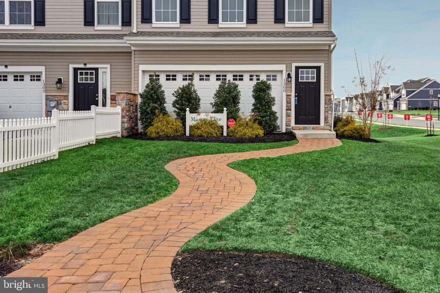 MASSEY ELITE END UNIT- 3 bedrooms, 2.5 baths, 2 car garage. Approx. 2380 SF! 12x10 Deck. This home features a Finished den, 42" cabinets in kitchen, island, stainless gas range, dishwasher, microwave, LVP flooring and recessed lighting in Kitchen. LVP floor and Tile Shower surround in master bath. 3 pc rough in walk out basement. Don't miss out on this spectacular floor plan! Builder Splits Transfer Tax. 
Beautifully appointed end unit townhome featuring 3 bedrooms, 2.5 baths, and approximately 2,380 square feet of living space. This home includes a 2-car garage and a 12x10 deck overlooking open farmland. Interior features include upgraded luxury vinyl plank flooring throughout the main level, a gourmet kitchen with granite countertops, Level 3 cabinetry, a large center island, and a gas range. The primary suite offers a spacious layout with a walk-in closet and private bath. Located in one of the community’s most desirable settings with no building in front, open space surrounding, and ample parking.