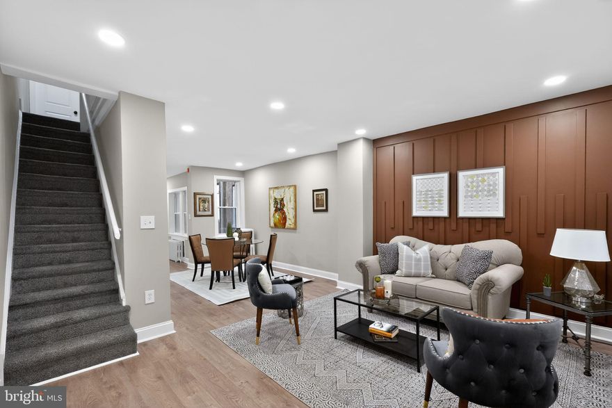 Welcome to 2002 Laveer Street, Philadelphia, PA 19138. This well-maintained three-bedroom, one-bathroom home offers a thoughtful blend of modern updates and comfortable living space. The main level features laminate wood flooring throughout the living room, dining room, and kitchen, creating a cohesive and inviting layout. The newly renovated kitchen is equipped with white shaker cabinets, stainless steel appliances, and stylish black accent hardware. Upstairs, you’ll find three spacious bedrooms, all with wall-to-wall plush carpeting, along with a fully renovated bathroom featuring a new vanity, ceramic tile flooring, a ceramic tile shower, and a new commode. The basement is partially finished with laminate wood flooring and parged walls, providing additional usable space. Conveniently located, this move-in-ready home is a great opportunity for today’s buyer.