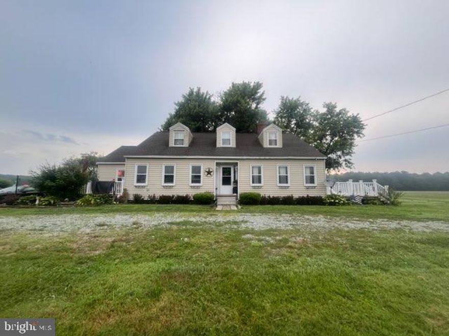 3 bedroom, 1 bath Cape cod is on 1.38 acre cleared lot in a country sitting.  As you enter in foyer to the right is a large living room with fireplace.  to the left is dining room that is currently used as a living room.  the large kitchen has been renovated and has beautiful counter tops and tons of cabinets space.  Under the carpets are original hardwood floors.  As you make your way down the hall there are 3 bedrooms and a renovated bathroom.   Upstairs is unfinished but floored. The 900 +/- feet is presently used for storage but could easily be converted to a bedroom with bath or an additional family room with bath.  Home has private setting in the country.  Sit outside on either of the 2 decks and enjoy peaceful living.  Just outside of town, you can experience the rural way of life, yet shopping and restaurants are just minutes away. A short ten-minute drive to boating, fishing and crabbing on the Chesapeake Bay too! There is damage floors in the back of house that needs to be repaired.