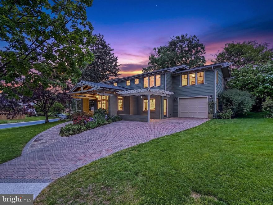 Set on a beautifully positioned corner lot just steps from nature, this exceptional home stands out with arguably the best curb appeal in the entire neighborhood and has been impeccably maintained. Originally built in 1959 as a Colonial, this gorgeous 4-bedroom, 4.5 bath home was fully renovated and transformed in the Arts & Crafts style in 2013 by DC architect JC Cummings. Freshly painted inside and out, the home offers three finished levels of thoughtfully updated living space infused with countless upgrades. ***** A striking brick and Hardiplank exterior with a custom brick paver driveway, 1-car garage, slate walkways and covered front and side porches, expert landscaping, covered rear porch, large stone patio with stacked stone sitting walls, and a lush, fenced backyard surrounded by trees and privacy plantings create instant outdoor appeal. ***** Inside, you’ll find an open floor plan, oak hardwood flooring, decorative moldings, custom built-ins, high ceilings and an abundance of easy to open and clean windows in every room filling the space with natural light. An open foyer with a soaring ceiling and walls of windows welcomes you, as rich hardwood flooring flows into the spacious living room with built-in oak bookcases, the family room/office with a cozy fireplace and the dining room accented by chair rail and chic pendant lighting. The adjoining kitchen remodeled in 2021 features an abundance of 42” white cabinetry, gleaming quartz countertops, designer tile backsplashes and stainless-steel appliances. The breakfast area features a custom-built table with matching quartz top and serving/bar area. Step outside to the porch, patio and expansive, private backyard that is a peaceful retreat—perfect for relaxing and entertaining. A powder room and a huge laundry/mud/pet room with supersized 2024 washer/dryer on pedestals and wood cabinets for extra storage complete the main level. ***** Hardwoods continue upstairs into the spacious primary suite with a soaring vaulted ceiling, walls of windows, a separate dressing area with built-in bench with storage, 3 large closets, an extra hidden closet, and a custom laundry chute. The luxurious marble and tile ensuite bath features a vaulted ceiling with skylights, heated floor, custom vanity with moveable sink mirror, a linen closet, water closet, and a huge frameless glass ultra-shower.  Down the hall, a junior suite enjoys a private bath, and two additional bedrooms share the hall bath, while the open loft/reading area can easily be enclosed as a 5th bedroom. ***** The finished lower level provides plenty of space for games, media, and exercise in the expansive multi-area recreation room. A 4th full bath adds convenience, and a second laundry room, unfinished workshop, utility room, loads of storage space, and a large enclosed extra storage area complete the comfort of this wonderful home that reflects true pride of ownership. ***** Ideally located near the Locust Grove Nature Center, Wildwood Shopping Center, Montgomery Mall, and major commuter routes including I-270 and I-495, this home combines suburban tranquility with everyday convenience. Enjoy easy access to Metro, top-rated schools, NIH, and Walter Reed, all while living in a warm, established community known for its charm and walkability. For a home with strong fundamentals, timeless appeal, expert renovations, and the perfect blend of space, style, and comfort in a stellar location, this is it!