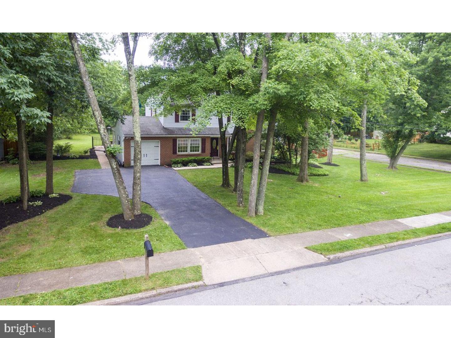 Welcome to this Beautiful Traditional Colonial situated on a large manicured corner property in Norriton Woods. This stunning home has been completely renovated with upgraded finishes starting as you enter to the foyer with gleaming hardwood flooring then off to your right, you will find a large formal living room also with hardwood floors and a brick fireplace for those cozy nights and large windows that offer plenty of natural light. The formal dining room also with hardwood floors, crown molding, and an Anderson sliding door that leads to a large deck. Let's not forget this brand new kitchen features Maple Mocha solid wood cabinets, granite countertops, ceramic tile floor and backsplash, along with brand new stainless steel appliances.  Just off the kitchen is a spacious great room with wood beam ceilings. Next to the great room is an optional bedroom and full bath which could be a possible in-law suite or a large office with a full bath. There is also huge laundry area with outside entrance that is spacious enough be also used as a mud room.  A huge finished basement with newly installed lament wood flooring with plenty of closets for storage is I ready to be used in so many ways, it is an open pallet for your design. The master bedroom is very spacious with a completely new ceramic tile bath, two double closets and a vanity area. The second floor also features a new full hall bath and three additional bedrooms, all generously sized and with plenty of closet space. The home provides an enormous amount of outdoor living space with a picturesque yard including a fenced in-ground pool, a deck, and a covered patio perfect for dinning and grilling. The property backs up to 9.4 acres of preserved land. Award winning Paul Fly Elementary School is down the street. The house is conveniently located to Rt. 422, 202, 309, 476 and PA Turnpike. Come and check out this amazing home you will not not be disappointed.