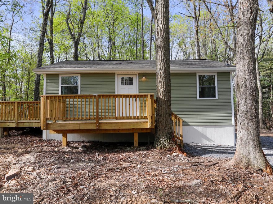 *multiple offers* Wow! Newly updated 2 bed 1 bath modern cabin tucked away in the woods but close to access Rt9!  This home features new roof, siding, windows, hvac, decks, plumbing, electric, kitchen, LVP floorings, lights, and bathroom!  Everything is new!  The kitchen features white shaker cabinets, quartz countertops and stainless steel appliances.  Spacious decks to relax on and privately tucked away perfect for gatherings around the firepit!  New well and septic installed 2025. Check this one out today!