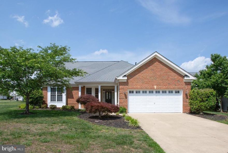 BIG REDUCTION!Make your best offer and move in tomorrow!! Elegant contemporary former model home offers spacious contemporary living and great floor plan plus tons or parking!  NEW carpet, Fresh paint,  New garage door and opener!Sunroom! Patio! Front Porch!Traditional Gathering area! Large stainless and granite Kitchen with tons of storage and great gathering and eating space! Formal Dining! Office! All naturally flow together with lovely natural light. Main level has 2 bedrooms including a comfortable Owners Suite with large Bath and room-sized closet. Plus there's a cozy loft offering Bedroom and full bath- great for storage, hideaway or special spot for grandchild. Flexible and spacious with no basement this home offers a unique opportunity in main level living with a lovely lot and mostly NEW 9 zone irrigation system. This fabulous home is walking distance to Virginia Heritage's amenity filled clubhouse which includes both indoor and outdoor pools, gym and so much more.