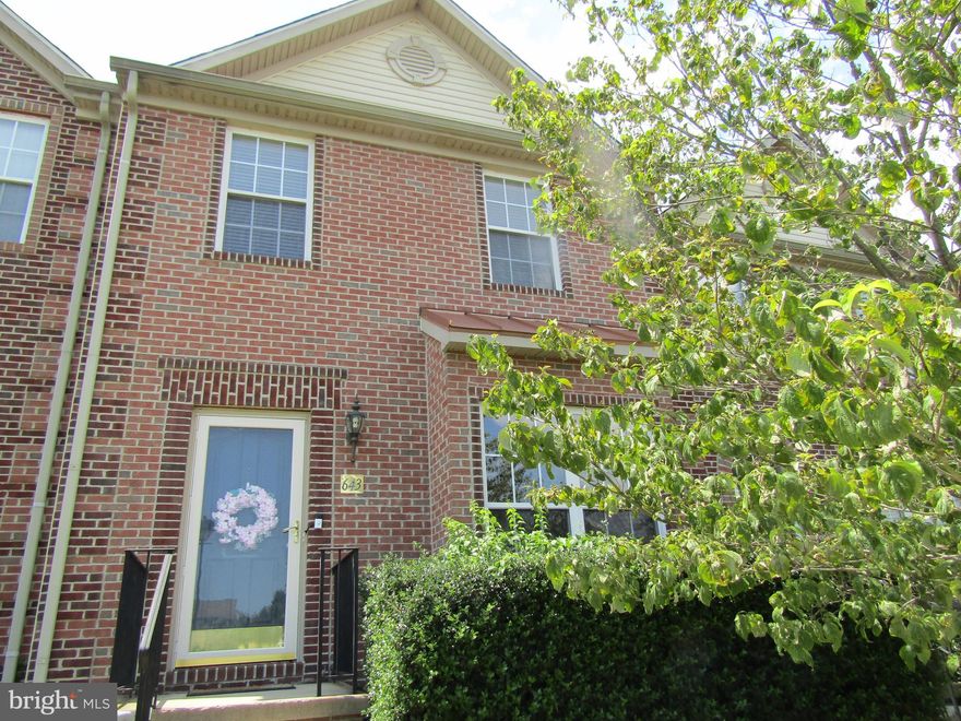 PRICE REDUCTION.Brick front townhome located in desirable community of Monmouth Meadows. Three level bump out. Premium fenced lot backing to Harford Glen and walking trail.   First level includes living room/dining area, large eat-in kitchen with Corian counters,  opening to sunroom with exit to maintenance free deck and flat rear yard.  Bay window... Upper level includes Owner's  bedroom with garden bath, two additional bedrooms and bath.  Lower level finished with rec room, half bath and tons of storage.  Seller willing to replace carpet and paint with ratified contract of sale.  Immediate occupancy,