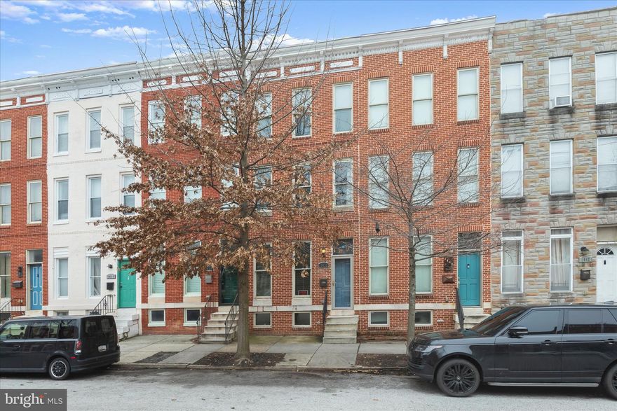 Charming 4-Level Baltimore Townhome with Private Deck & Parking

Welcome to this beautifully updated brick townhome offering the perfect blend of classic Baltimore charm and modern upgrades. Built in 1910, this spacious residence features 3 bedrooms, 3 bathrooms, and four finished levels, providing plenty of room for comfortable living and entertaining.

Step inside to an inviting open main level highlighted by gleaming hardwood floors, tray ceilings, recessed lighting, and a formal dining area. The updated kitchen with stainless steel appliances and upgraded countertops offers both style and functionality, making it ideal for hosting gatherings or everyday cooking.

The second floor includes two generously sized bedrooms, a full bath, and a convenient laundry closet, while the private third-floor primary suite provides a relaxing retreat with its own full bathroom and jetted tub (non-operable). Step outside to the 6' x 12' rear deck, perfect for enjoying quiet mornings or evening relaxation.

Additional highlights include a fully finished basement and off-street parking via a rear parking pad. This home offers both indoor comfort and outdoor convenience, all within easy reach of downtown Baltimore amenities.

Don’t miss this opportunity to own a move-in-ready Baltimore townhome combining historic character with modern updates.