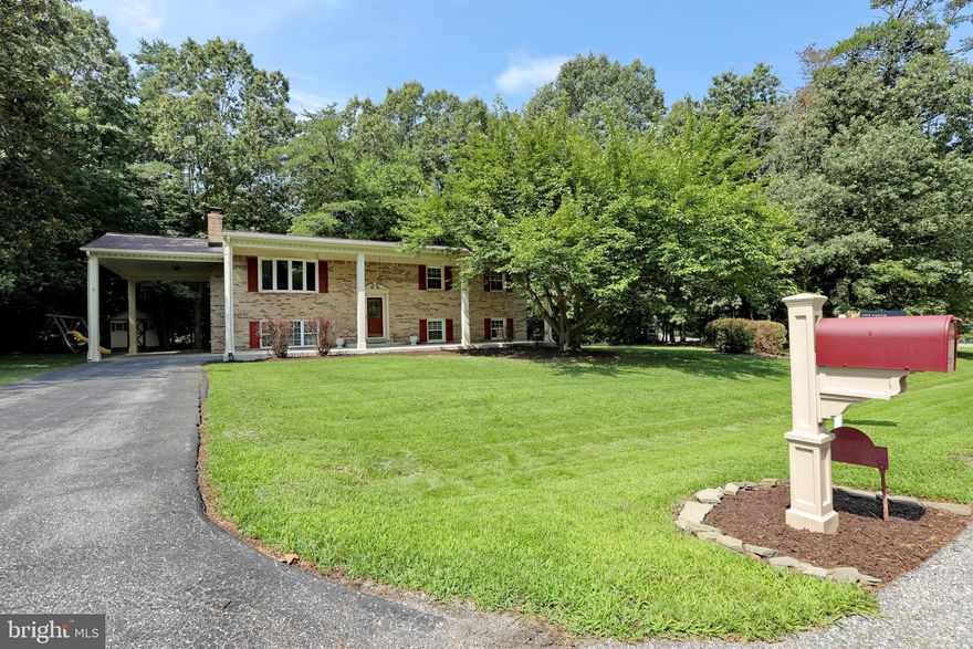 This beautiful 5 bdrm home is located just minutes outside of the “central” La Plata town amenities in the established community of Ellenwood, full of custom “non-cookie cutter” homes. From the new roof w/ architectural shingles, fresh paint, all new stainless kitchen appliances (except dishwasher), luxury plush carpet, built in cabinetry in lower level, brick fireplace, laundry/mechanical/mud room, 2 bdrms in lower levels w/ closets large windows, extra wide front full length concrete covered porch, it’s truly in pristine condition.   Situated on a large lot near a culdesac, the lot back to trees for privacy . Play set & shed to convey . Owner had new electric panel, new heat system (heat pump) just installed in July , home is in excellent condition.