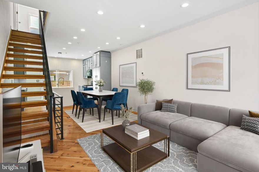 Built in 2018, this home perfectly blends modern design with everyday functionality. Step inside to an open-concept living space featuring warm hardwood floors, recessed LED lighting, and plenty of room to kick back and relax. The sleek kitchen is a chef’s dream, equipped with soft-close cabinetry, a waterfall island (perfect for morning coffee or impromptu charcuterie nights), a gas stove/oven, and a dishwasher—because nobody likes doing dishes. A huge sliding glass door leads to a charming backyard, ideal for hosting summer BBQs or simply enjoying a quiet evening under the stars.

Need extra space? The fully finished basement, complete with a full bath, is ready for whatever you need—home office, gym, guest suite, or your personal Netflix binge cave.

Upstairs, the second floor offers two spacious bedrooms, a full bath, and a conveniently located laundry area (because laundry in the basement is overrated). Head up one more level to the primary suite, where luxury awaits. This private retreat boasts a generous walk-in closet, a spa-like bathroom with a soaking tub, double vanity, and a glass-enclosed shower. Thoughtful details like custom molding and a coved ceiling with LED accent lighting make this space feel extra special—because you deserve it.

And now, for the grand finale: the rooftop deck. But before you take in those jaw-dropping city views, don’t forget to stop by the wet bar, complete with an under-counter wine fridge—because what’s a rooftop without a drink in hand? Whether you're sipping cocktails under the city lights or enjoying a peaceful sunrise with coffee, this rooftop is truly the cherry on top.

Property comes with Tax Abatement